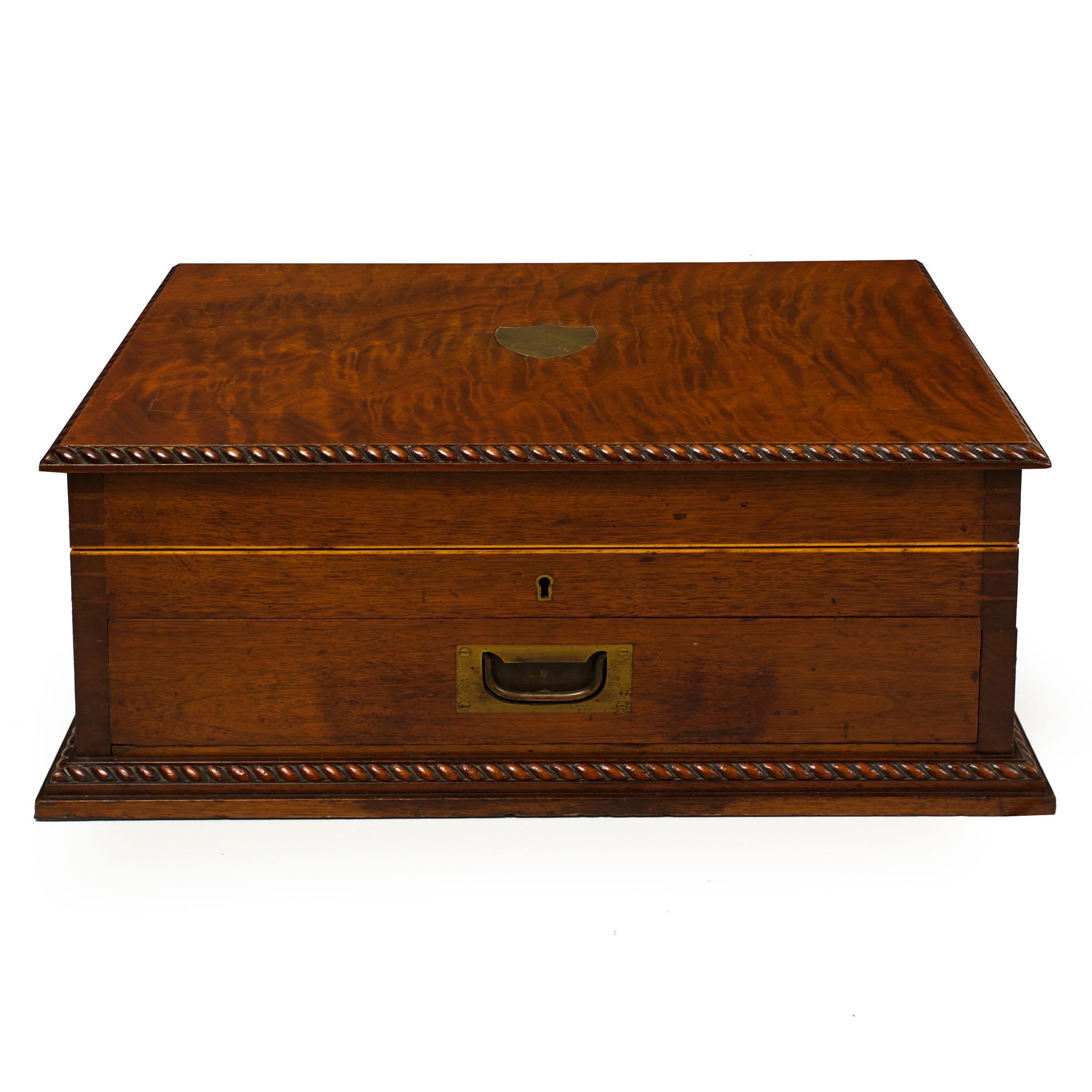 A gorgeous and inordinately well made cutlery box by Walker & Hall of Sheffield, it is executed in vibrant walnut primary woods throughout with matched gadrooned molding around the top and base. The joinery is of self-evident excellence, all corners