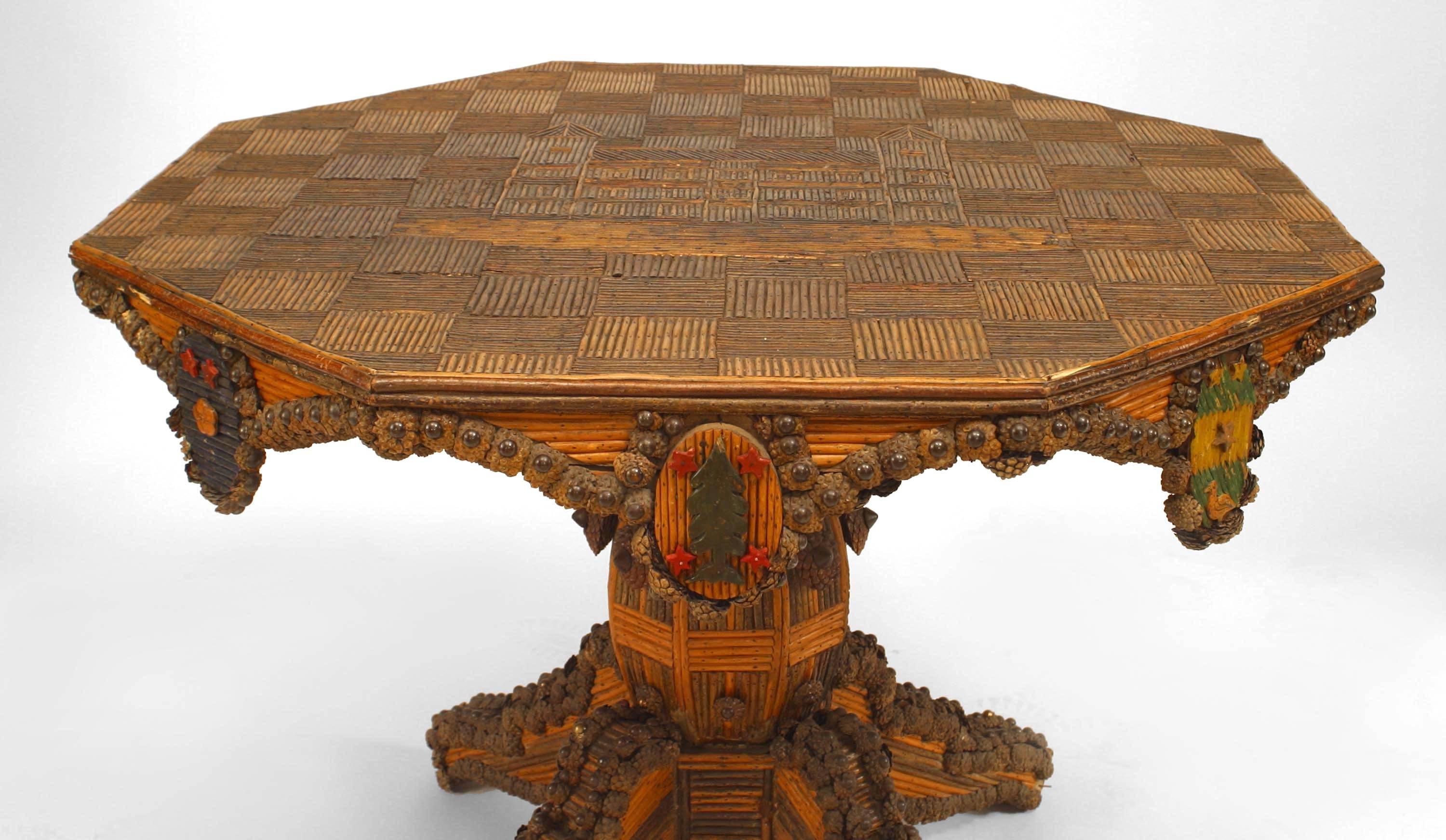Rustic Continental French (19th Century) slat twig design pedestal base center table with inlaid design of castle on octagonal top and medallions on apron with small pine cone trim.
