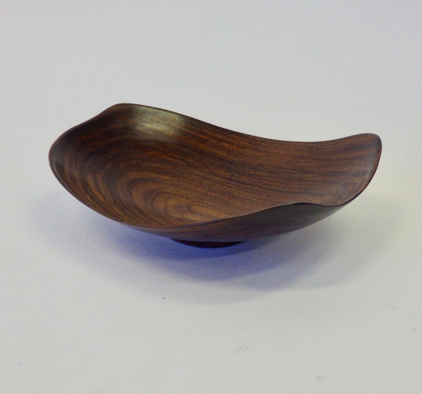 Nicely turned thin wall rosewood bowl. Apologies but illegible signature, date and wood type. There is an age crack.