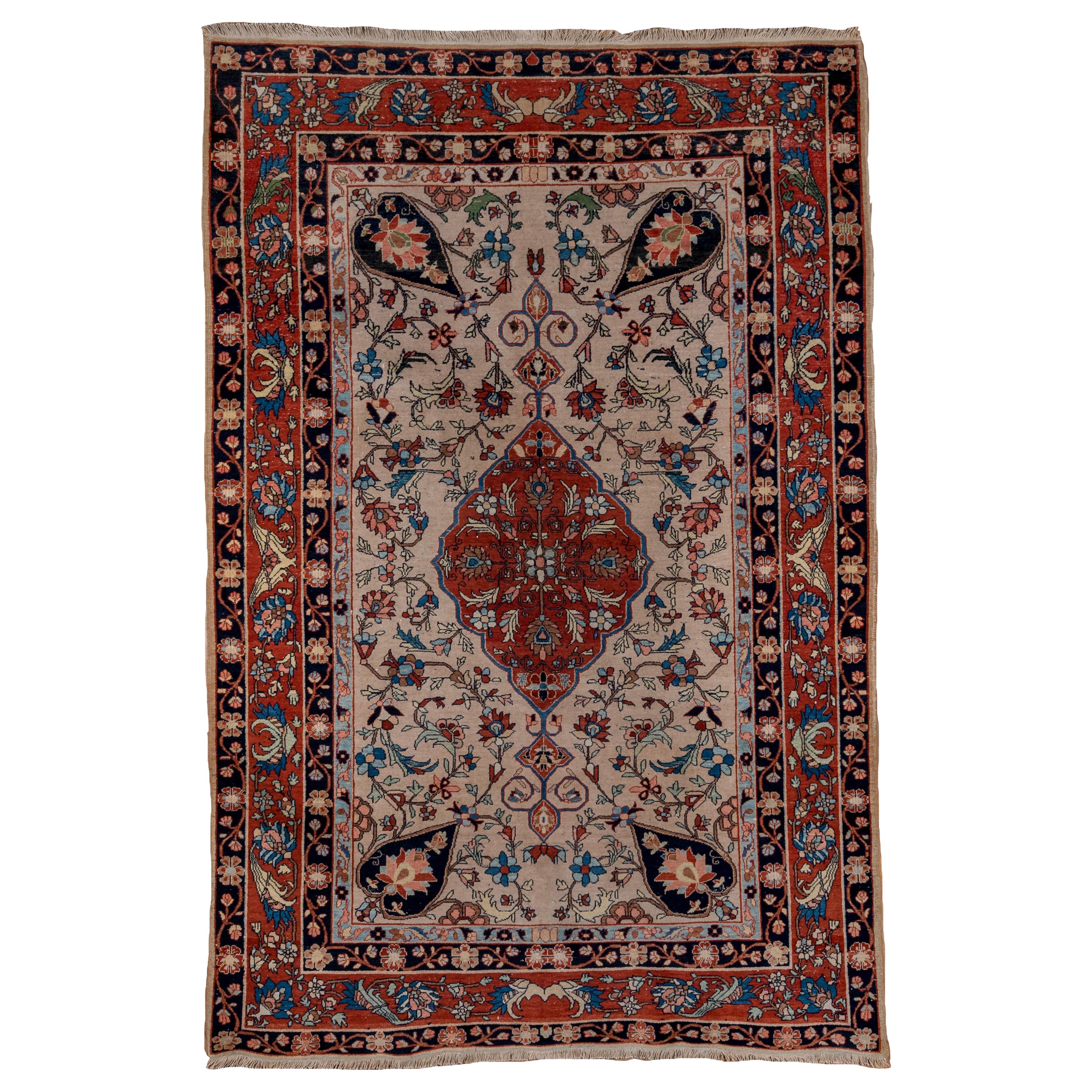 Tapis Farahan Sarouk ancien finement tissé, champ ivoire, bordures rouges, vers 1900