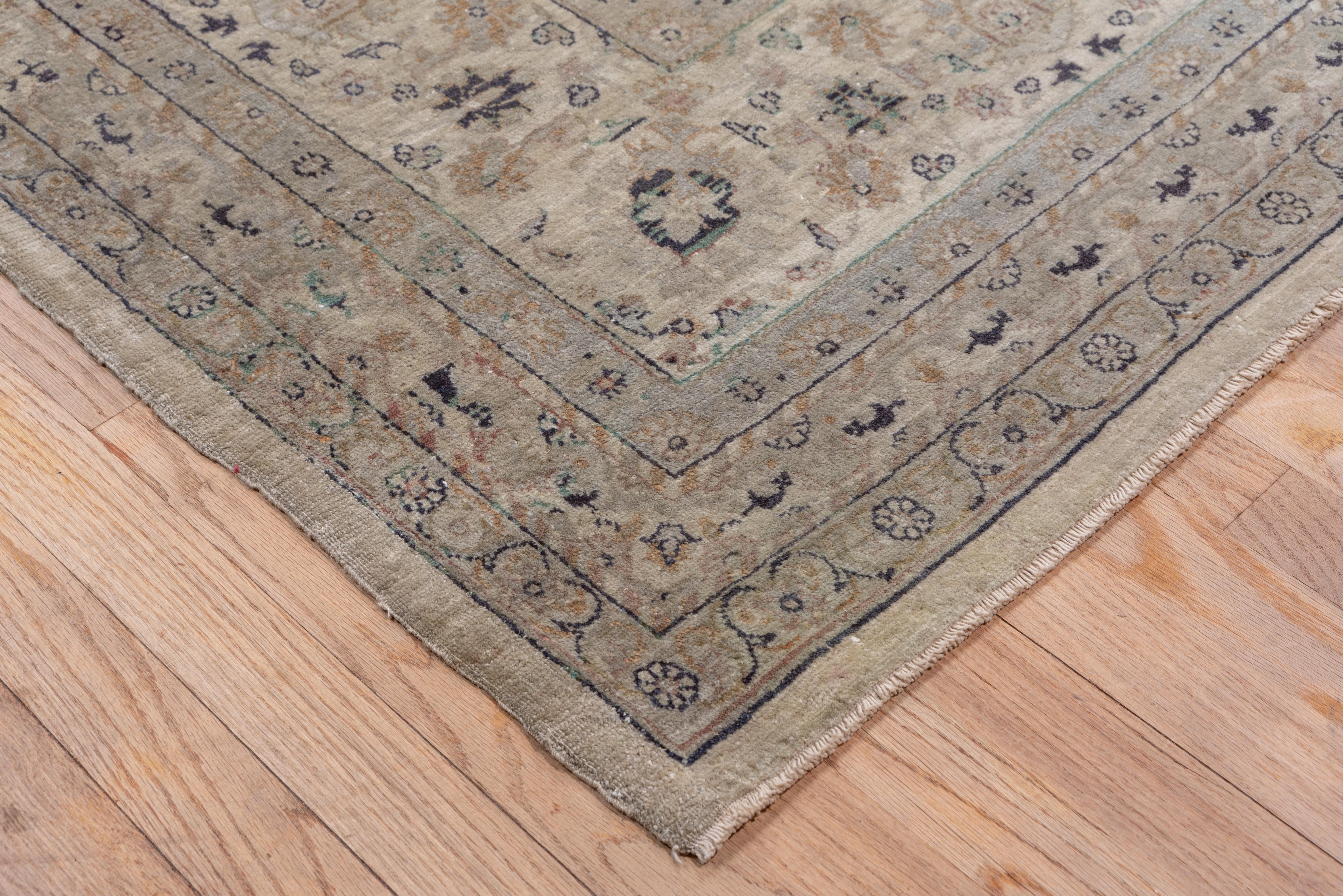 This eastern Anatolian well-woven town carpet features a small flower, little palmette, diminutive octogramme and minute palmette allover pattern on a cream ground, accented in wine red, rose, pale blue, green and umber. Beige palmette and round