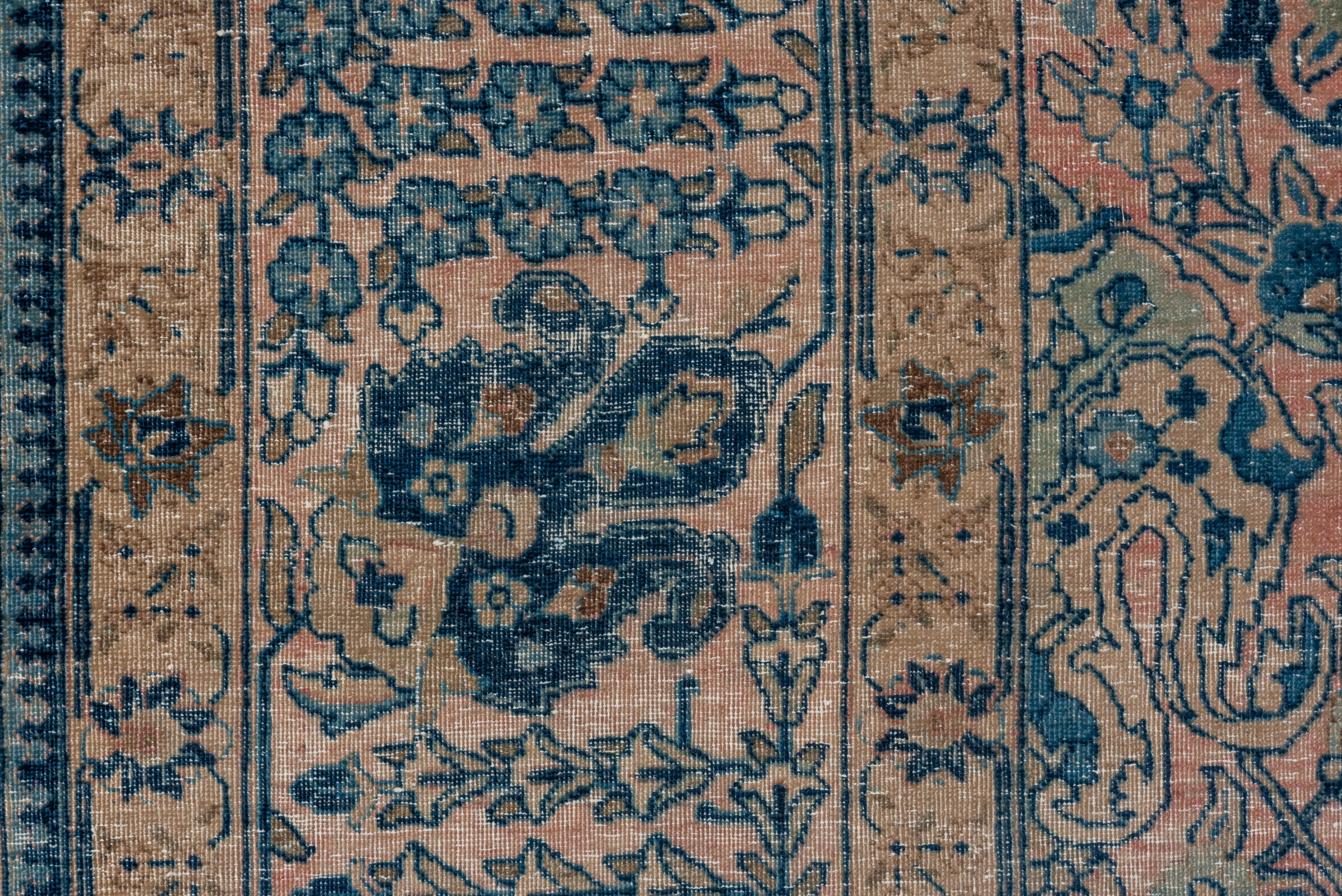 No medallion, but an allover panel design delineated by a serpentine meander lattice, all enclosing oval palmettes, cloud bands, dot arrays and cogwheel rosettes. Ivory and pink ground with accents in various blues. Iris anthora palmettes, petal