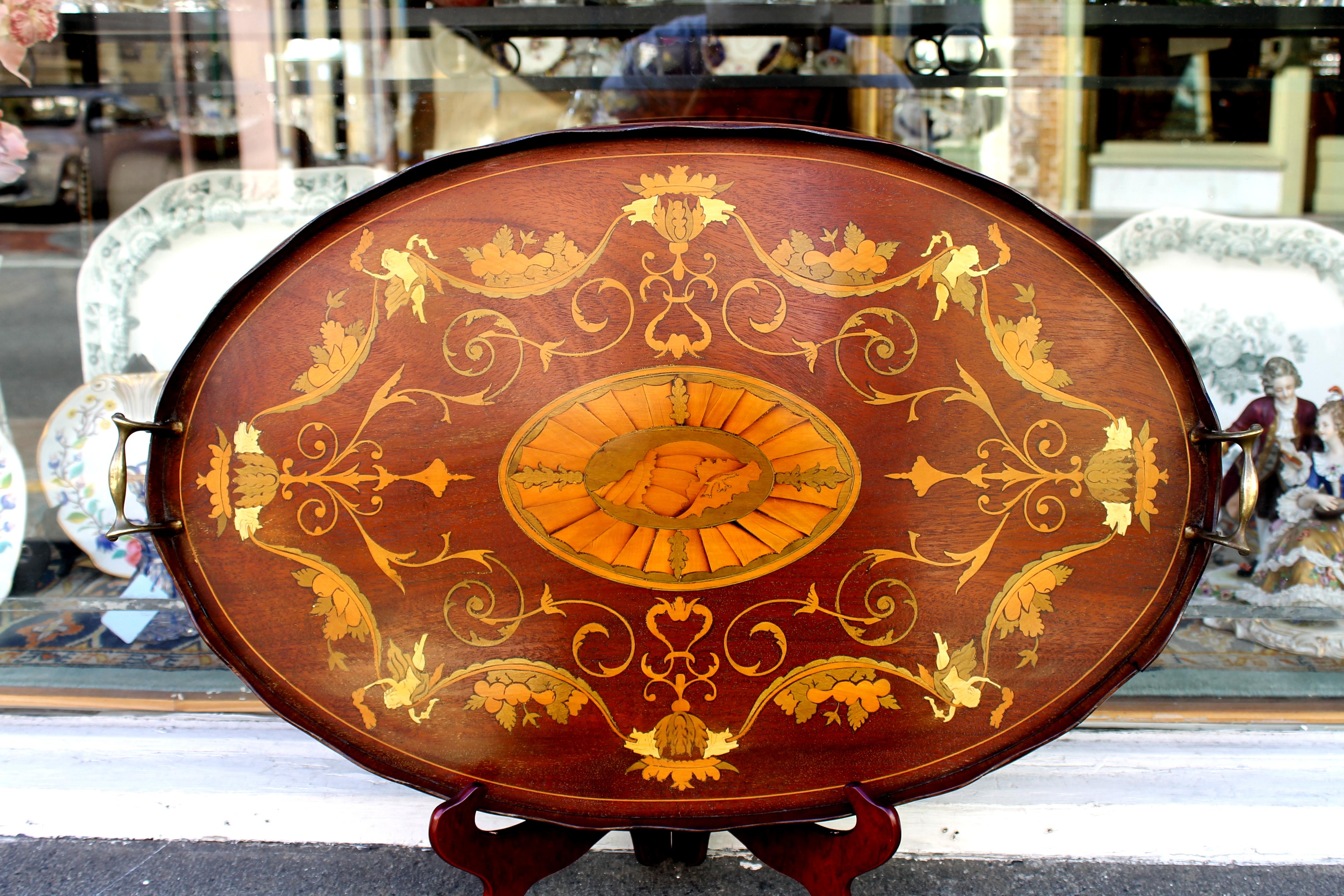 Quite possibly one of the most exceptional quality antique English marquetry inlaid mahogany 