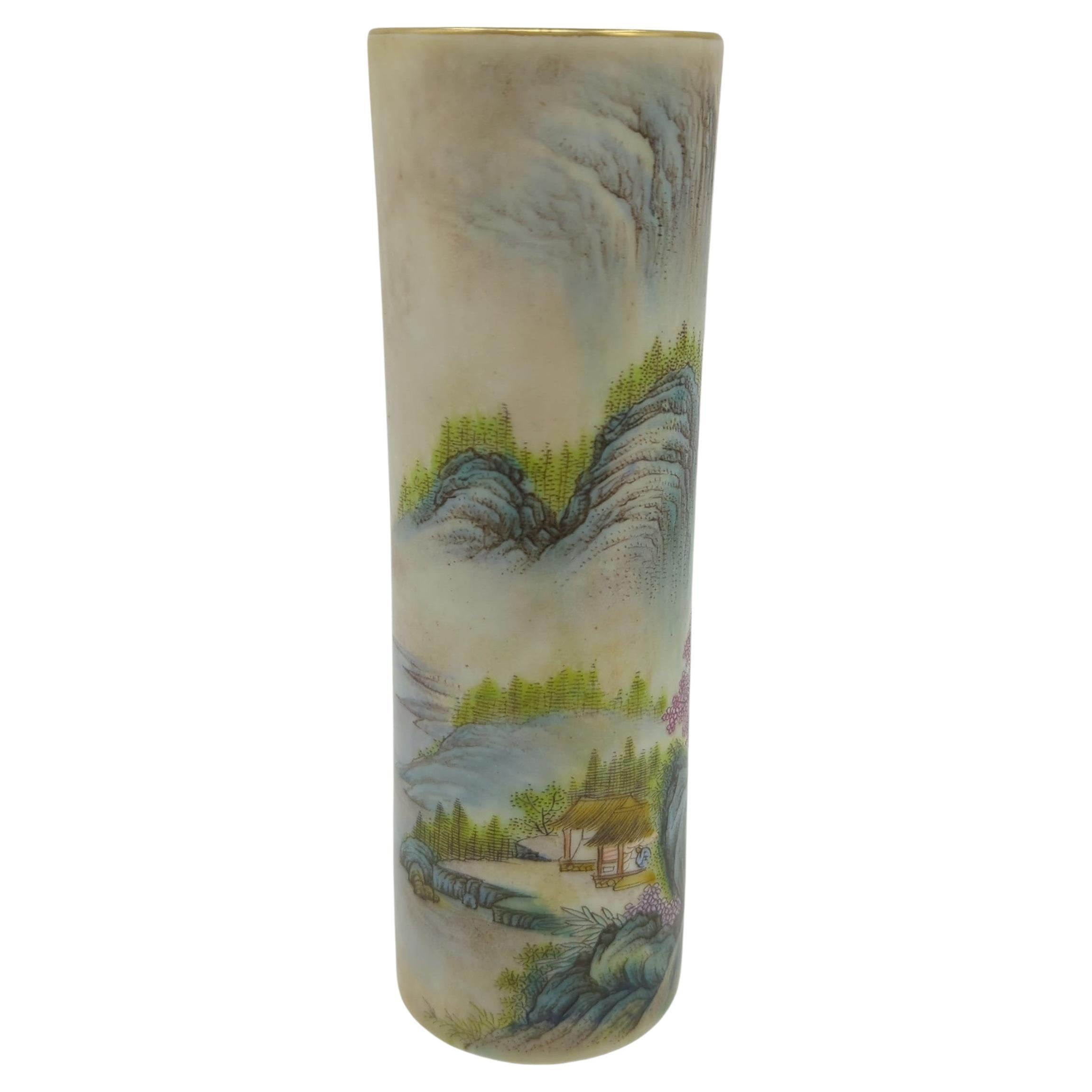 This exceptional cylindrical vase is a masterwork of Chinese ceramic artistry, rendered in the delicate and vibrant palette of Famille Rose Fencai enamels. The piece is a visual narrative, featuring a meticulously painted continuous scene of