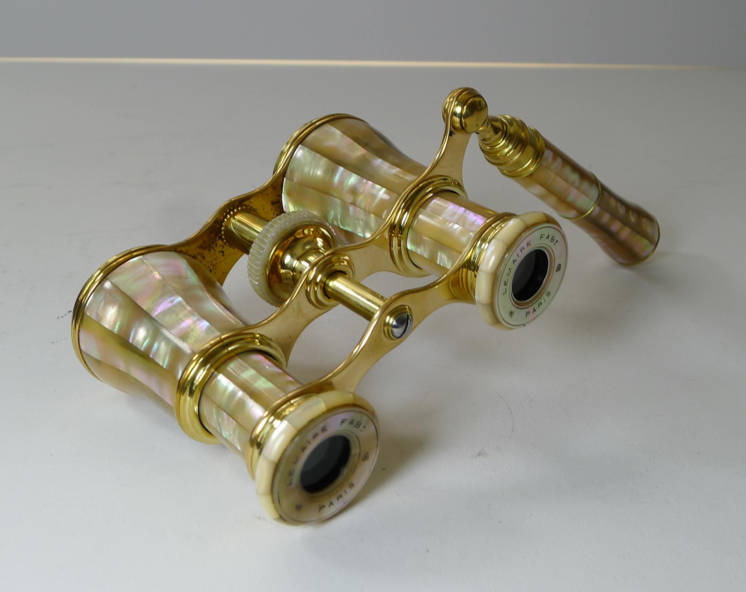A rare find, this is one of the finest pairs of Mother of Pearl Opera glasses we have had in many years. Of course they are made by the finest French manufacturer, LeMaire of Paris. 

Each of the eye pieces has the engraved and inked signature
