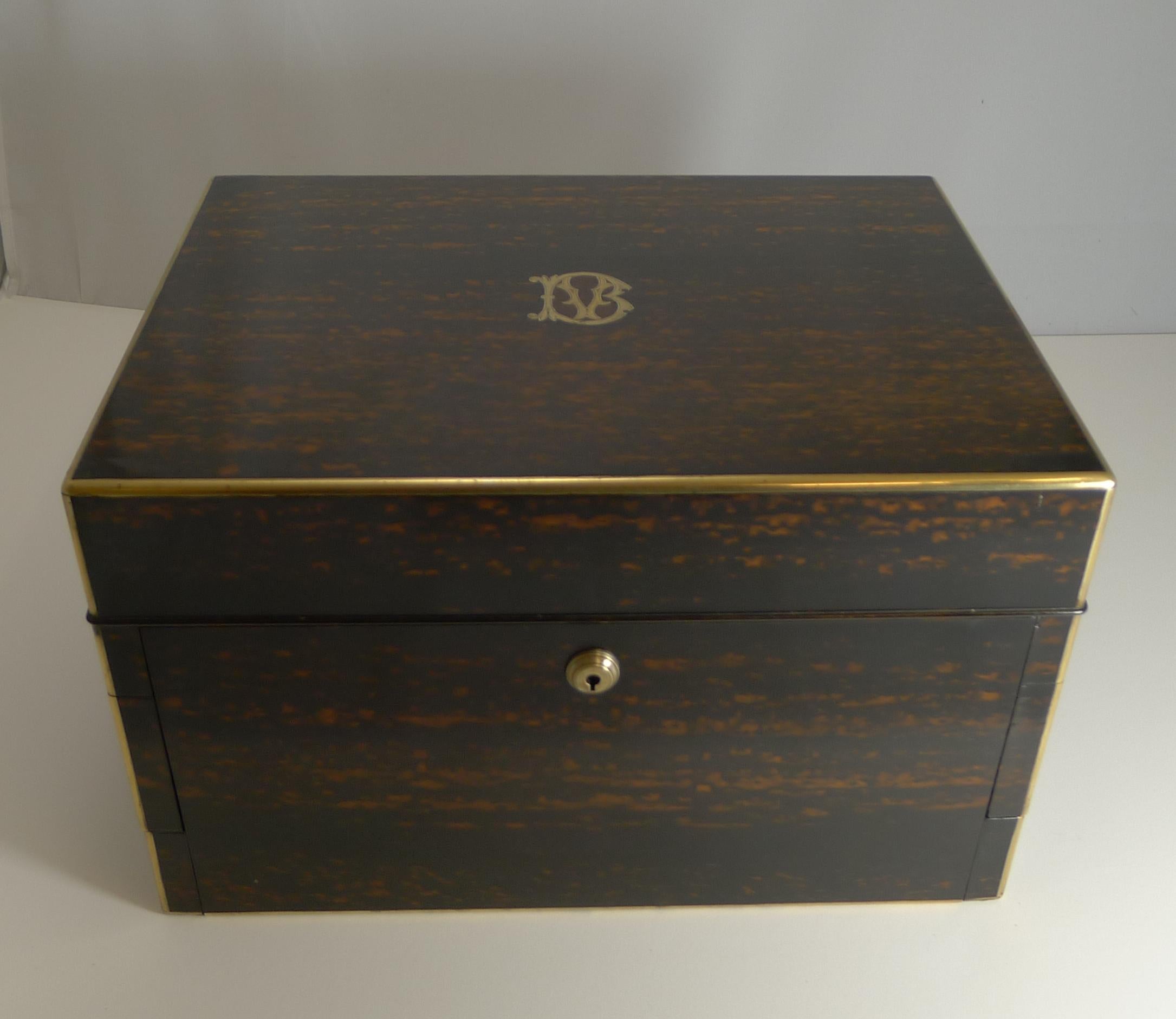 Grand Victorian English jewelry boxes like this come along very rarely, this one having all the bells and whistles with secret compartments everywhere!

Made from exotic Coromandal, the box is fully brass bound, the lid inlaid with the original