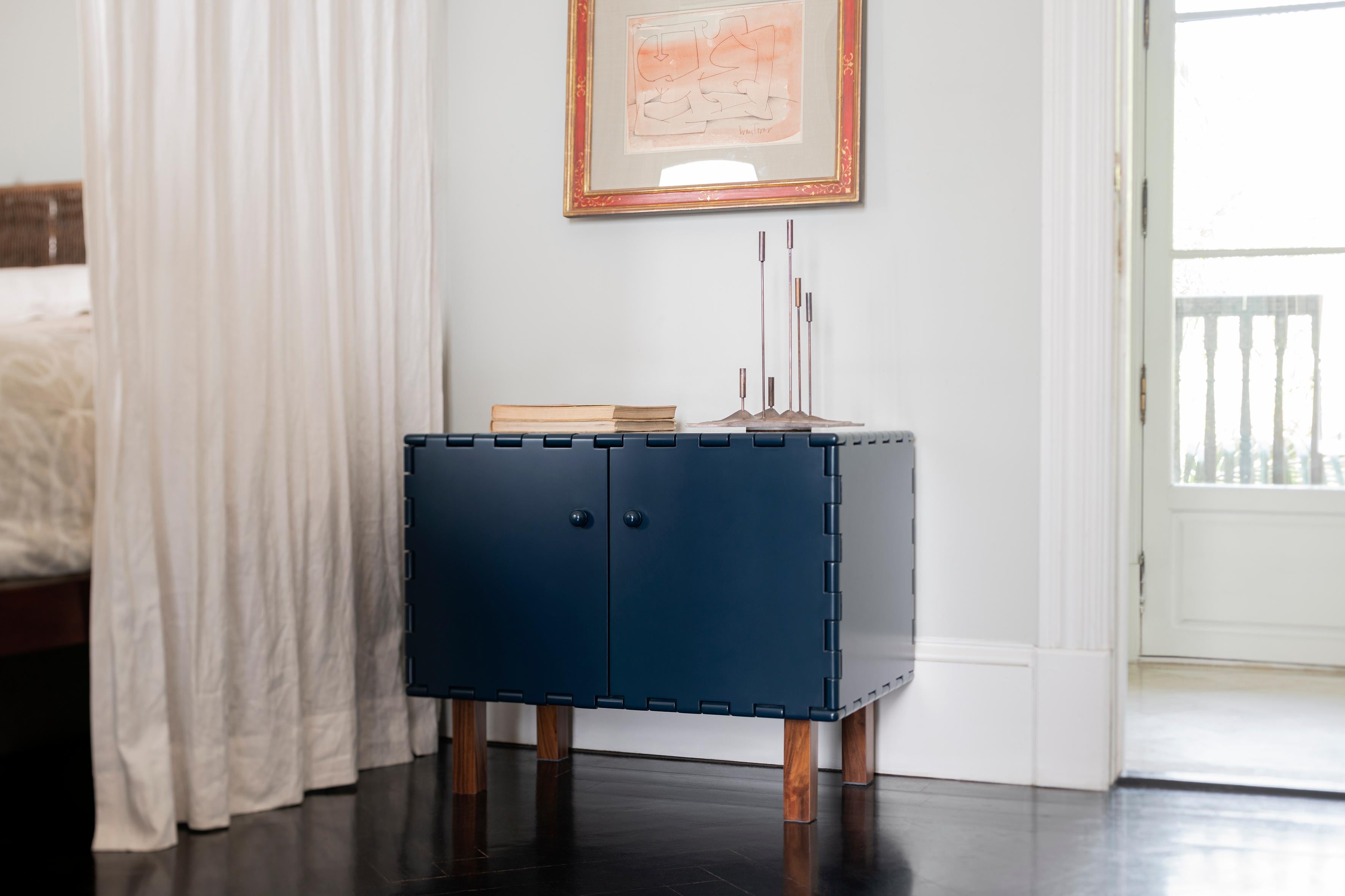 Handcrafted nightstand in lacquered wood. The lacquer color highlights the simplicity of the design. The modular quality of the collection allows each cabinet to be combined with other pieces within the collection to create different