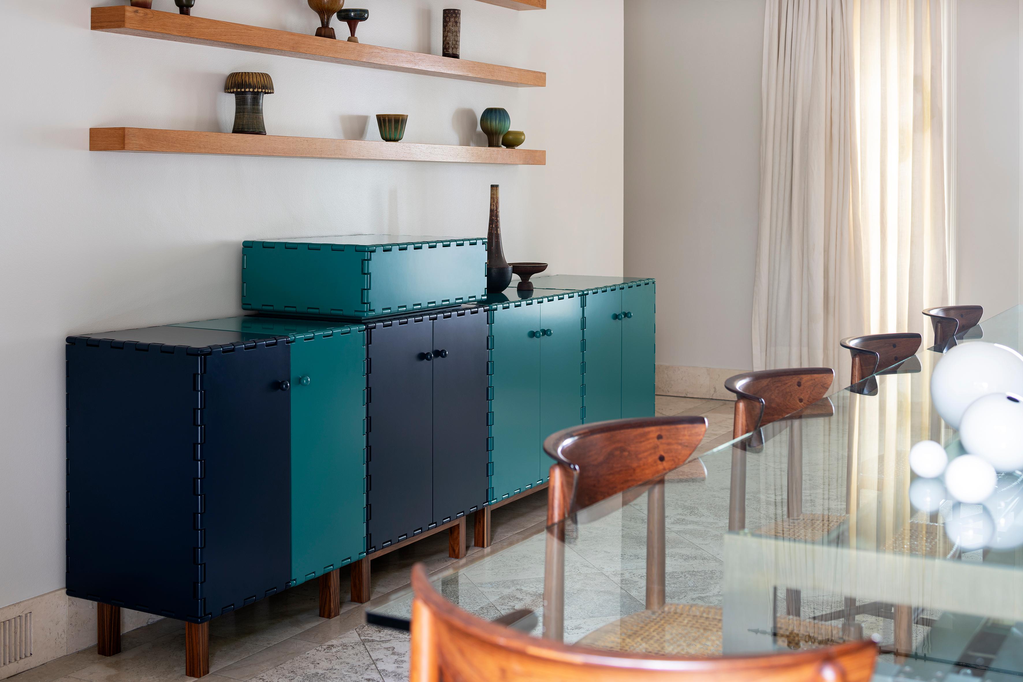 Handcrafted sideboard cabinet in lacquered wood. The lacquer color highlights the simplicity of the design details. The modular quality of the collection allow each cabinet to be combine with other pieces within the collection to create different