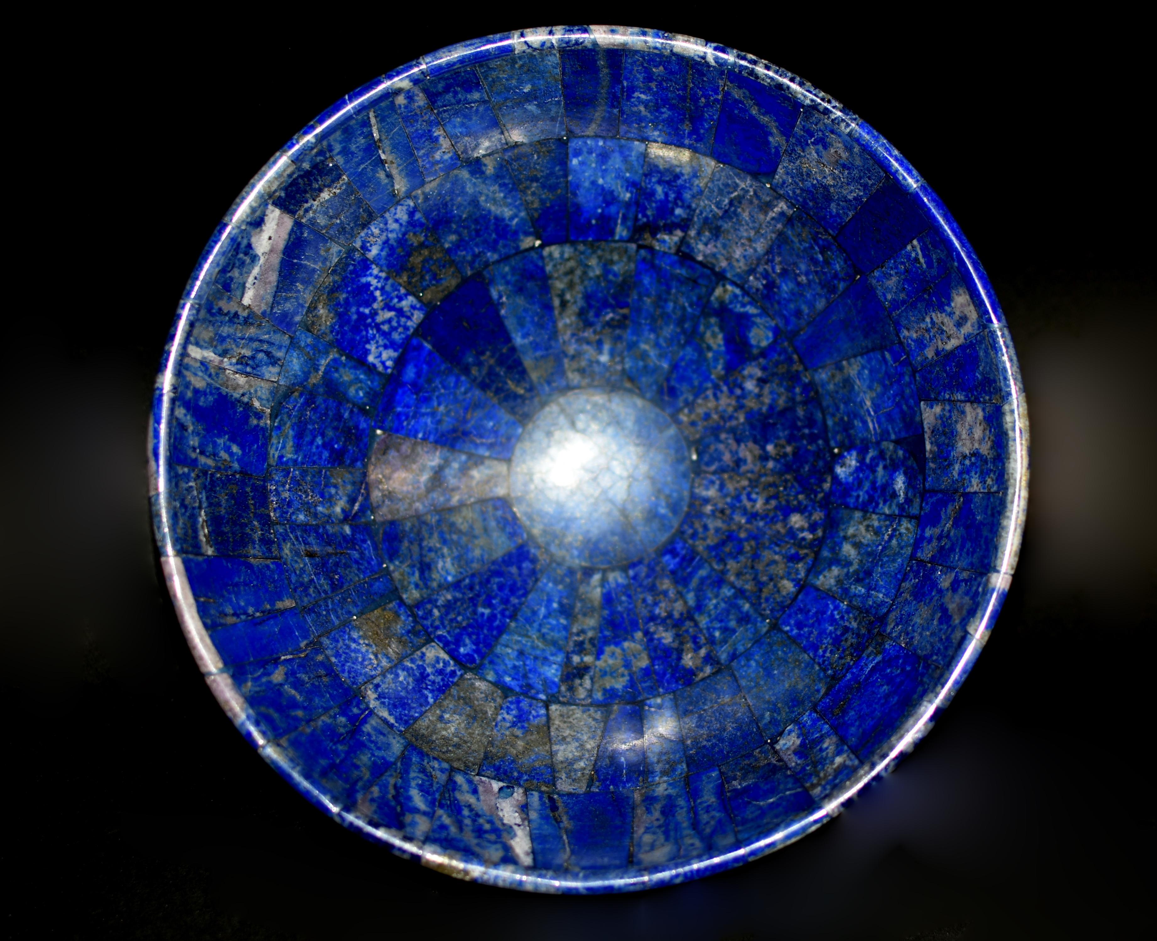 A beautiful lapis lazuli bowl. 100% natural, untreated, undyed, genuine stone. Bowl of conical form on a round base, polished to perfect smoothness. Stone of strength and wisdom, lapis enables us to recognize our abilities and knowledges. We have