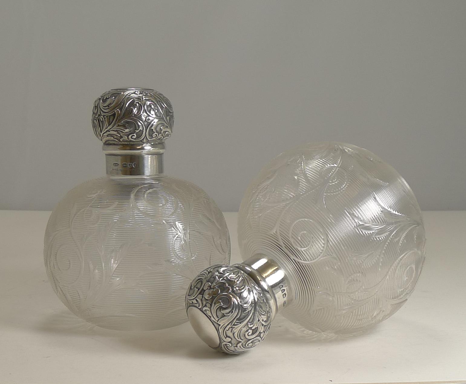 A rare and very fine pair of late Victorian perfume / scent bottles by the top-notch luxury retailer, Asprey of Bond St., London.

The glass is very, very unusual created from threaded glass which in turn has been beautifully hand engraved clear