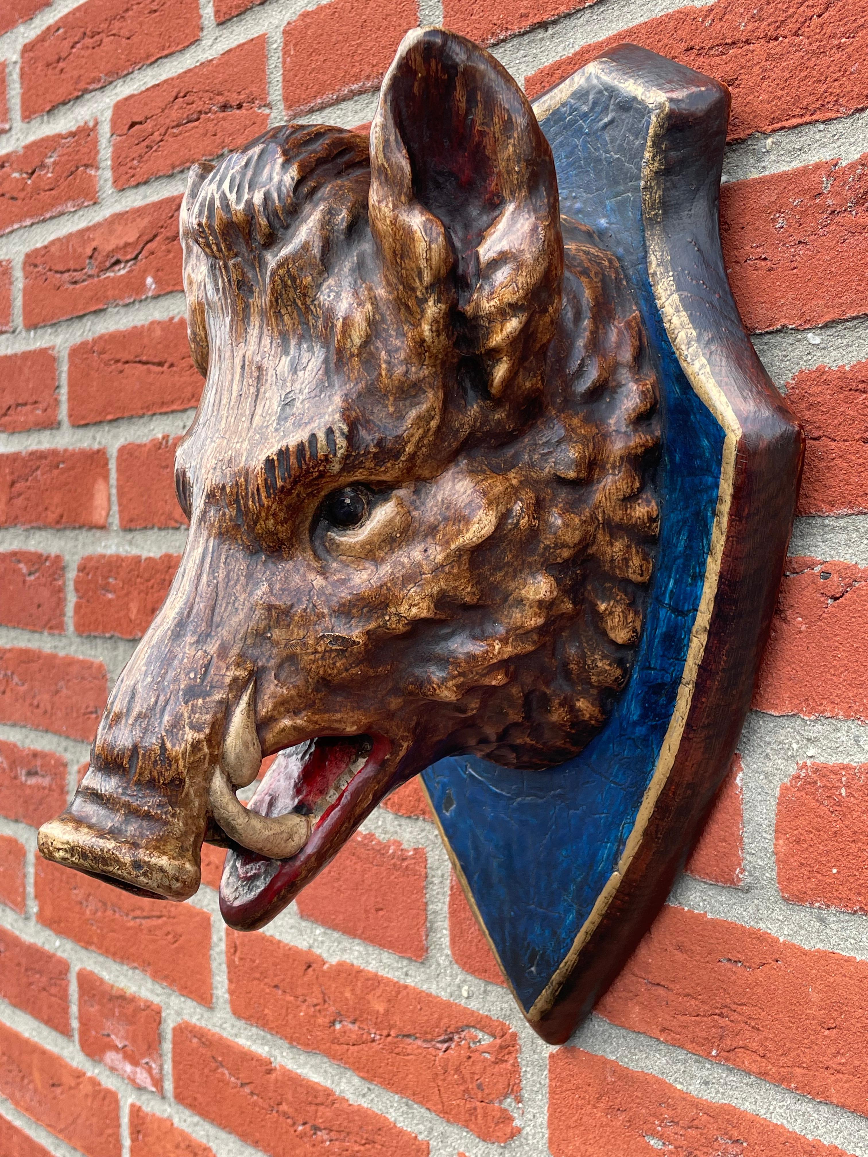 Amazing workmanship and mint Black Forest boar wall sculpture.

This perfect condition antique wooden sculpture of a wild hog on a wall plaque originates from the German Black Forest region and it was entirely hand-crafted in the mid to late 1800s.