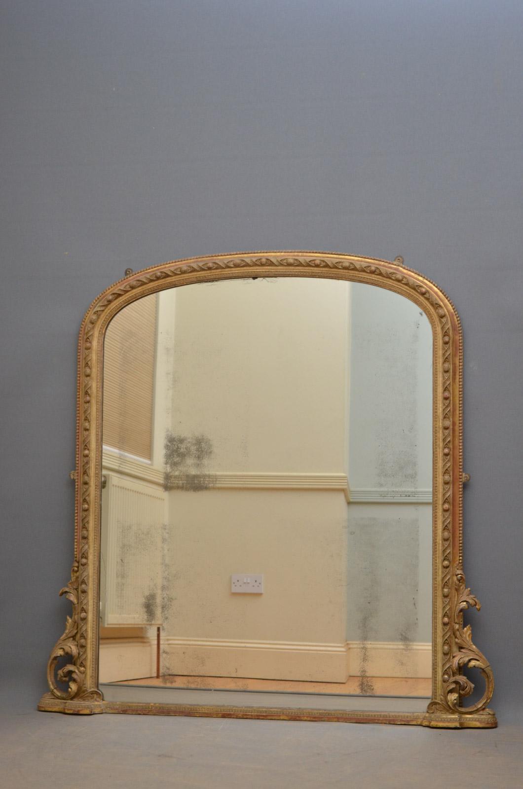 K0346, fine quality and very attractive early Victorian wall mirror, having original mirror plate with foxing in finely carved frame with scrolls to base. This antique mirror retains its original finish with wear consistent with age and use, all in