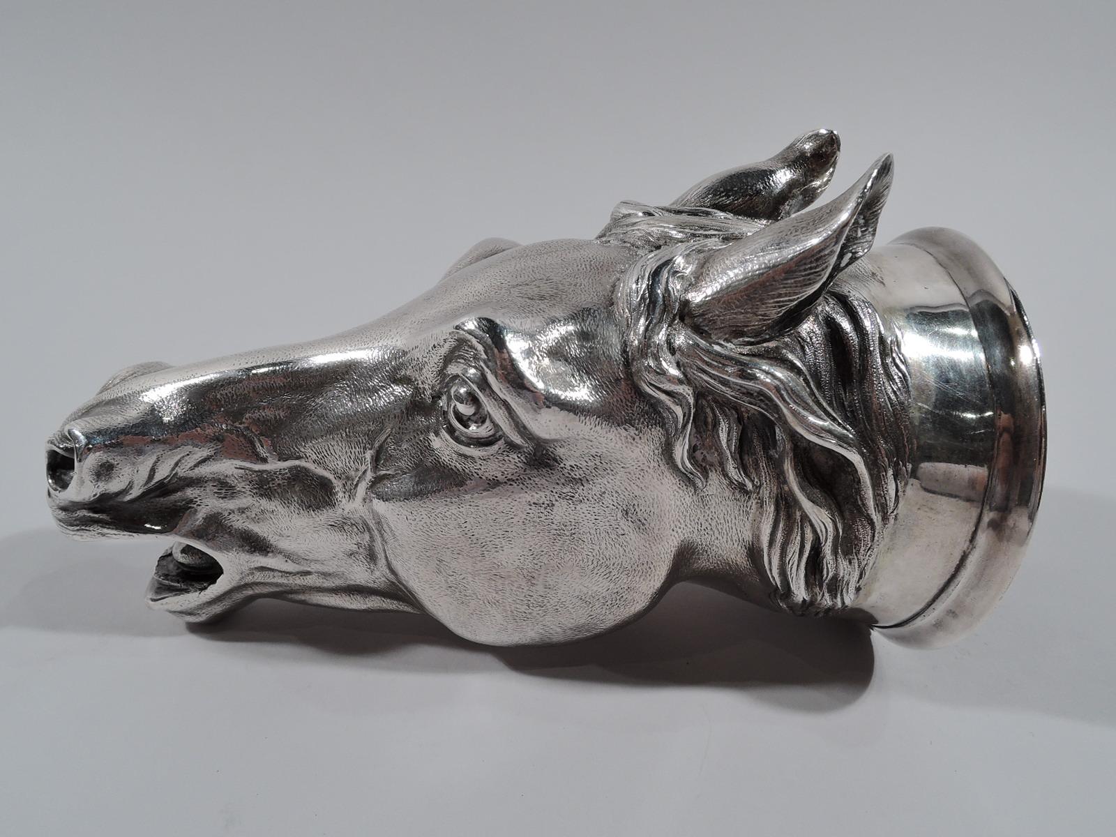 Traditional sterling silver stirrup cup. Made by Edward Barnard & Sons, Ltd in London in 1962. Cast horse head with gaping mouth, flexed-back ears, and alert eye. Perfect for the next hunt meet. Fully marked. Heavy weight: 17.5 troy ounces.