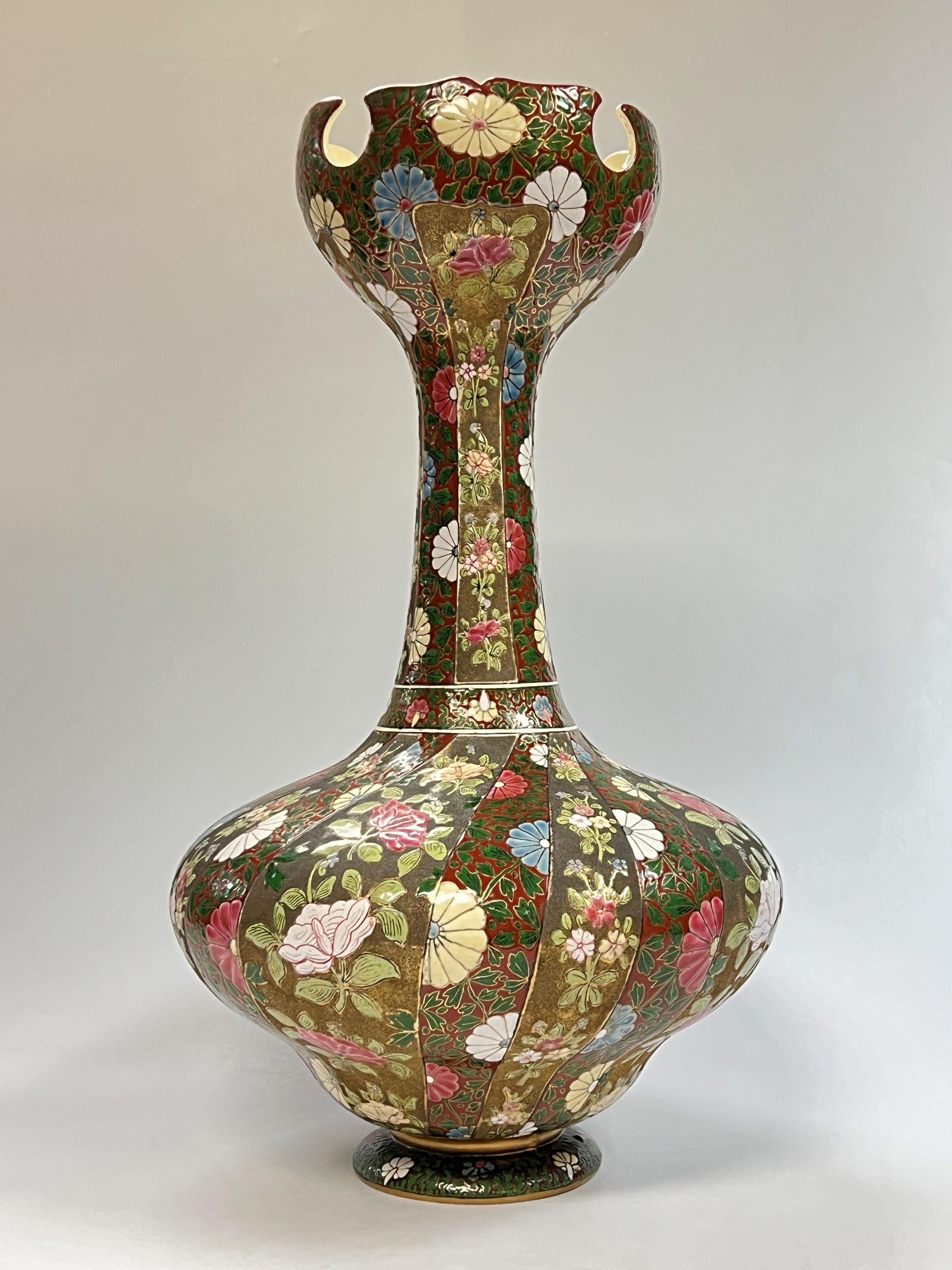 Monumental gilt and enameled ceramic vase by Fischer of Budapest, Hungary, 24 3/4 inches tall and 14 inches across, with multi-colored and textured floral bands.  
Possibly an Exhibition piece!!