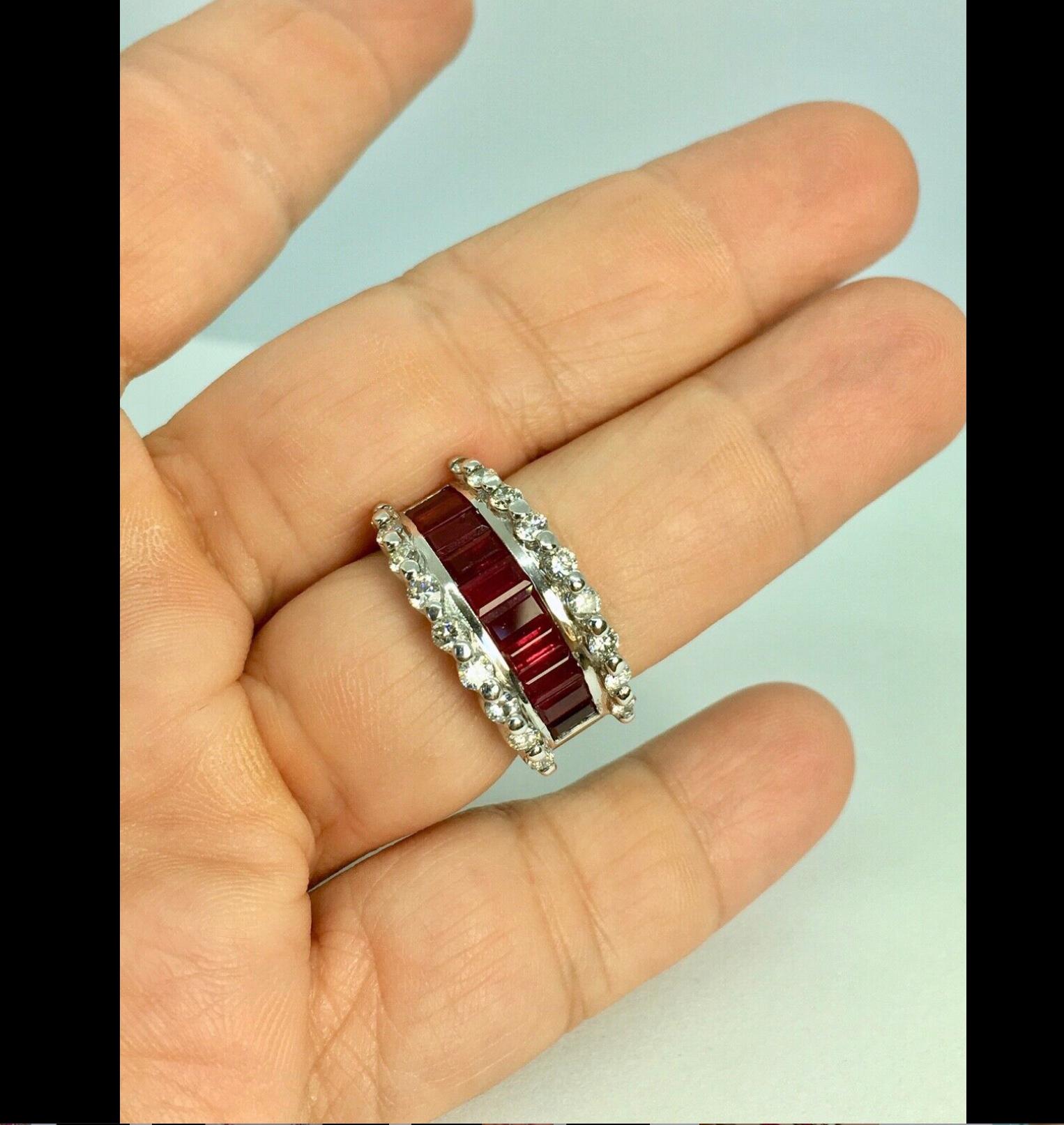 Channel Set Natural Ruby Weighing: 2.95 Carat. Second stone; natural round brilliant cut diamond weighing 1.00 carat, clarity VS2-SI1/ color G-H
Total gemstone weight: 3.95 Carat
Total Ring Weight: 7.9 Grams
Wide: 12 mm
Size: 7.75 
Condition: Used /