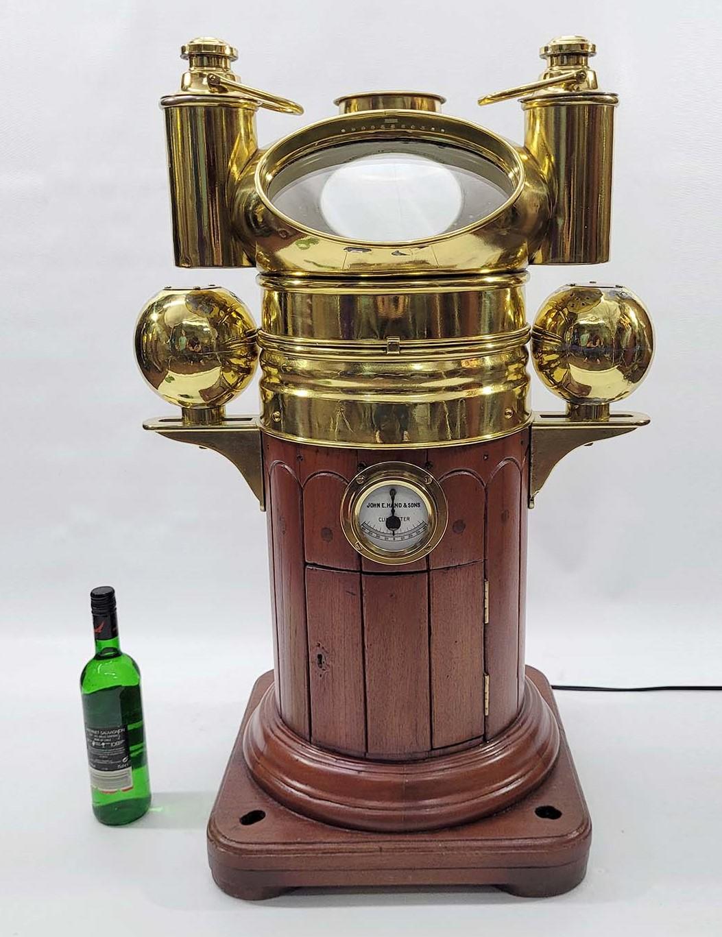 High quality nineteenth century ships binnacle from John Hand and Sons. Mushroom top with oil burners. Brass covers on the iron compensating balls. Brass brackets hold the balls. Brass clinometer from John E Hand and Sons is fitted to the base with