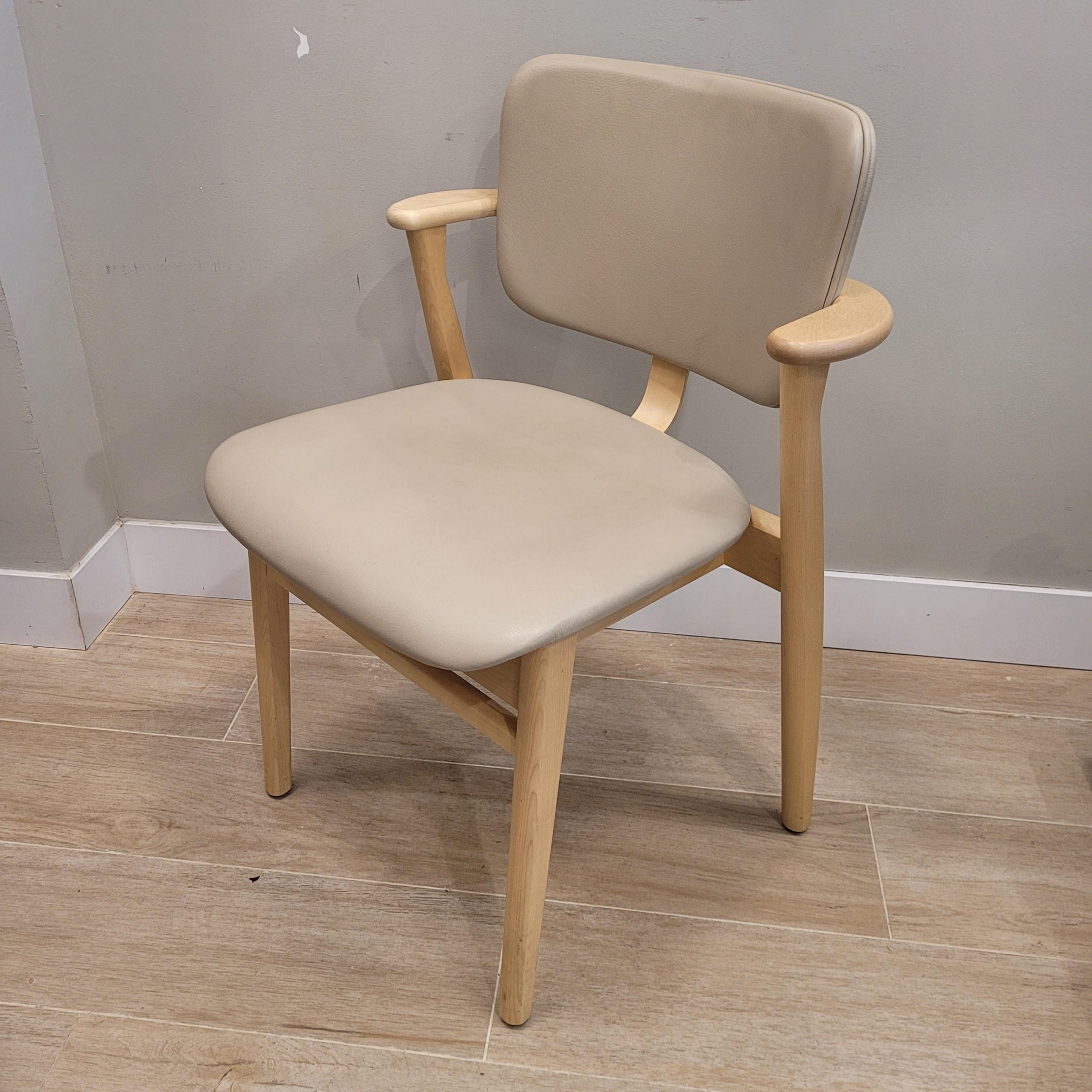Outstanding  Domus Couple of chairs, designed by Ilmari Tapiovaara as part of a series of furniture for the Domus Academica student residence complex in Helsinki. Its birch frame, with a seat and back filled with polyurethane foam and upholstered in