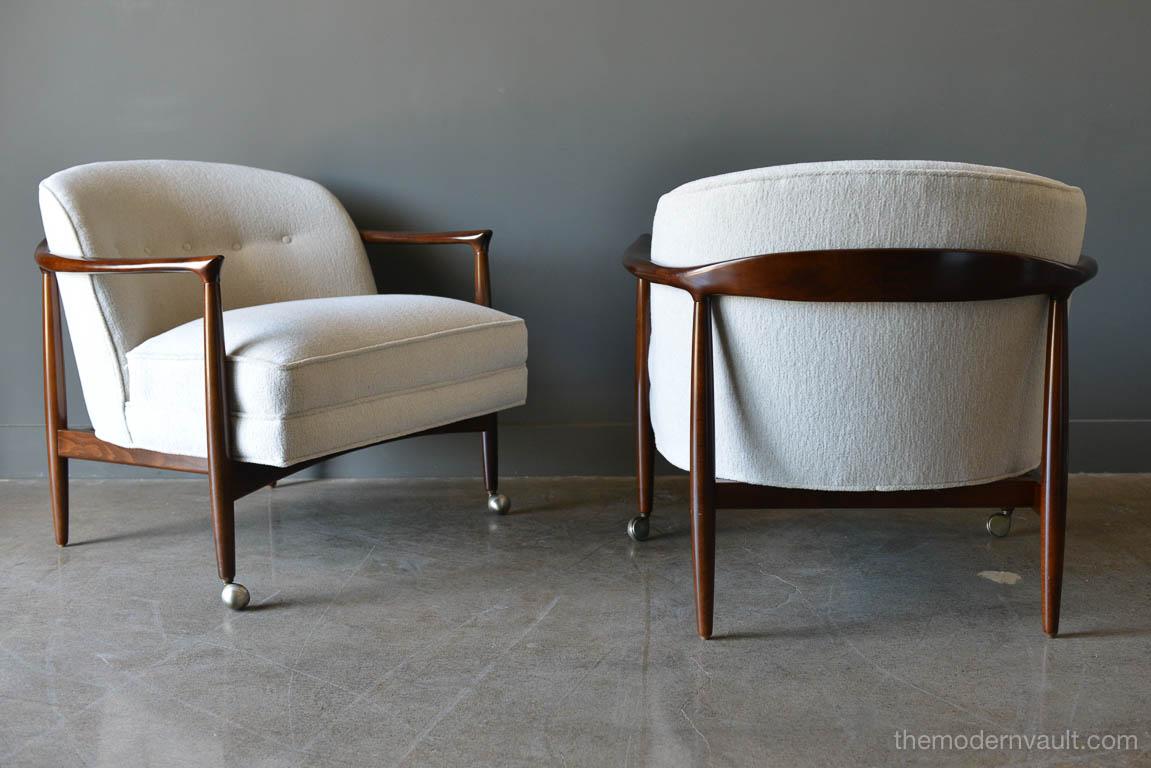 Finn Andersen for Selig Denmark sculpted barrel back lounge chairs, circa 1960. Sculpted walnut frames with newly upholstered imported Italian brushed linen in off white/oatmeal color. Beautiful walnut frames have been professionally restored.
