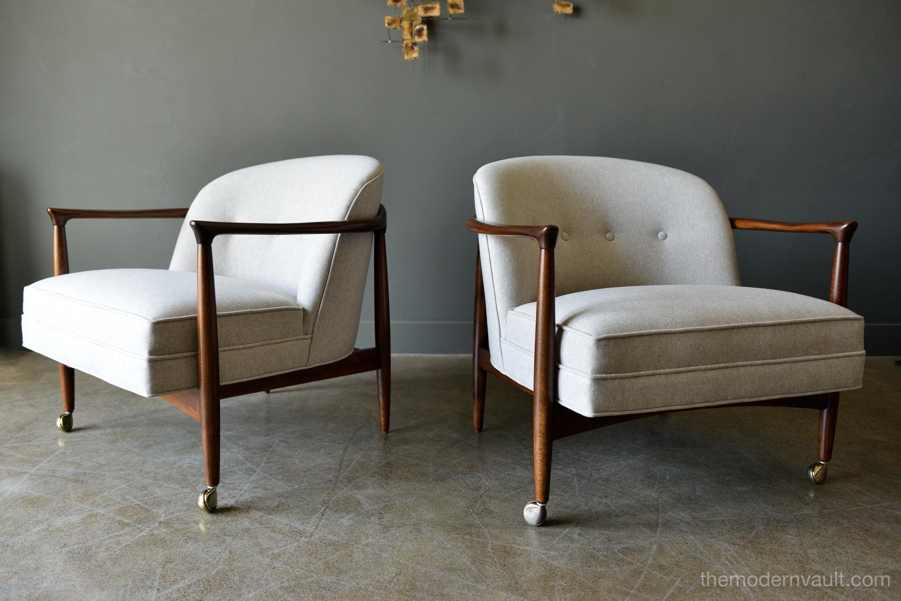 Finn Andersen for Selig Denmark sculpted barrel back lounge chairs, circa 1960. Sculpted walnut frames with newly upholstered imported brushed poly felt in a beautiful neutral oatmeal color. Walnut frames have been professionally restored. Original