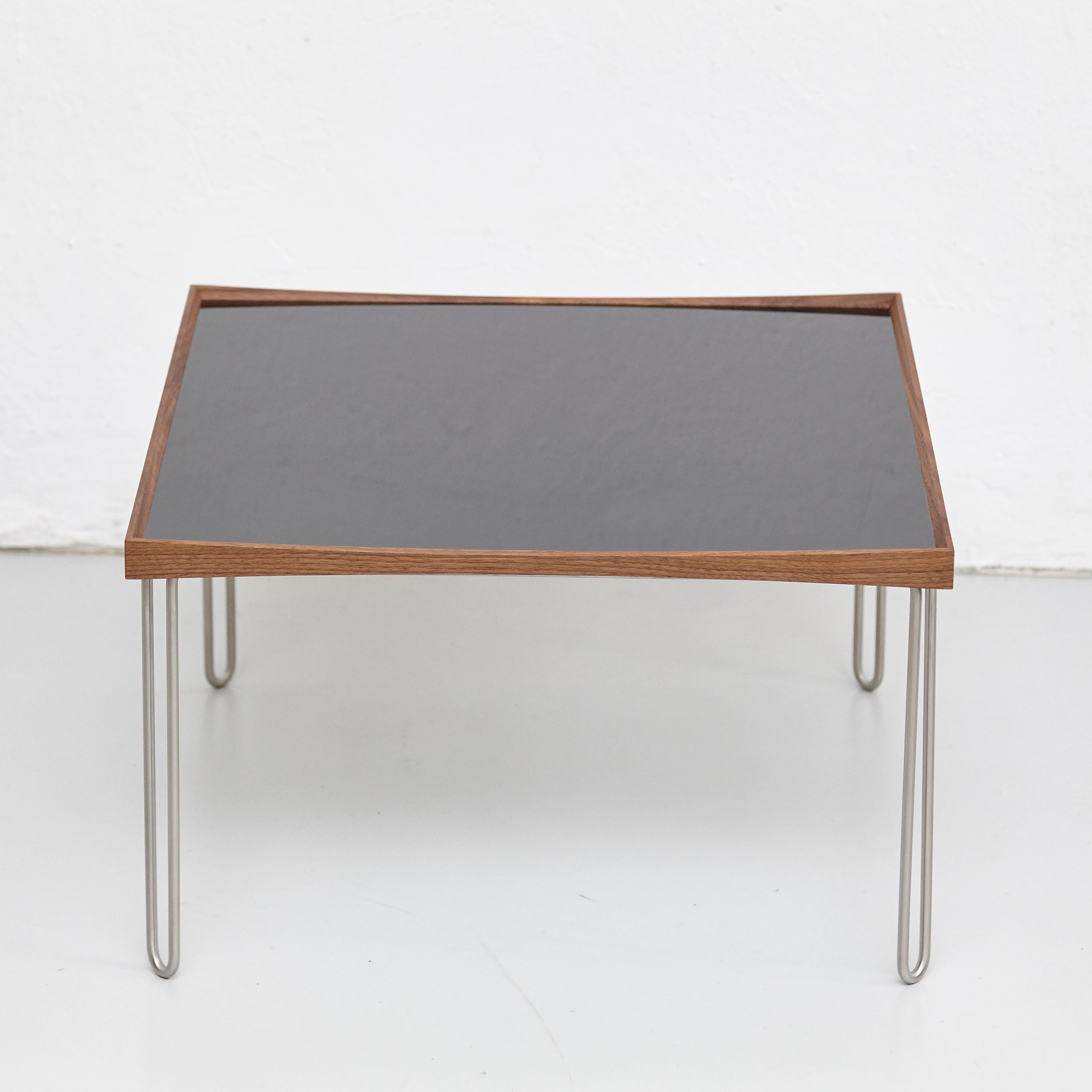 Table designed by Finn Juhl in 1965, relaunched in 2002.
Manufactured by House of Finn Juhl in Denmark.

The Tray Table, designed by Finn Juhl in 1965, is a further development of his famous Turning Trays, which today are manufactured by