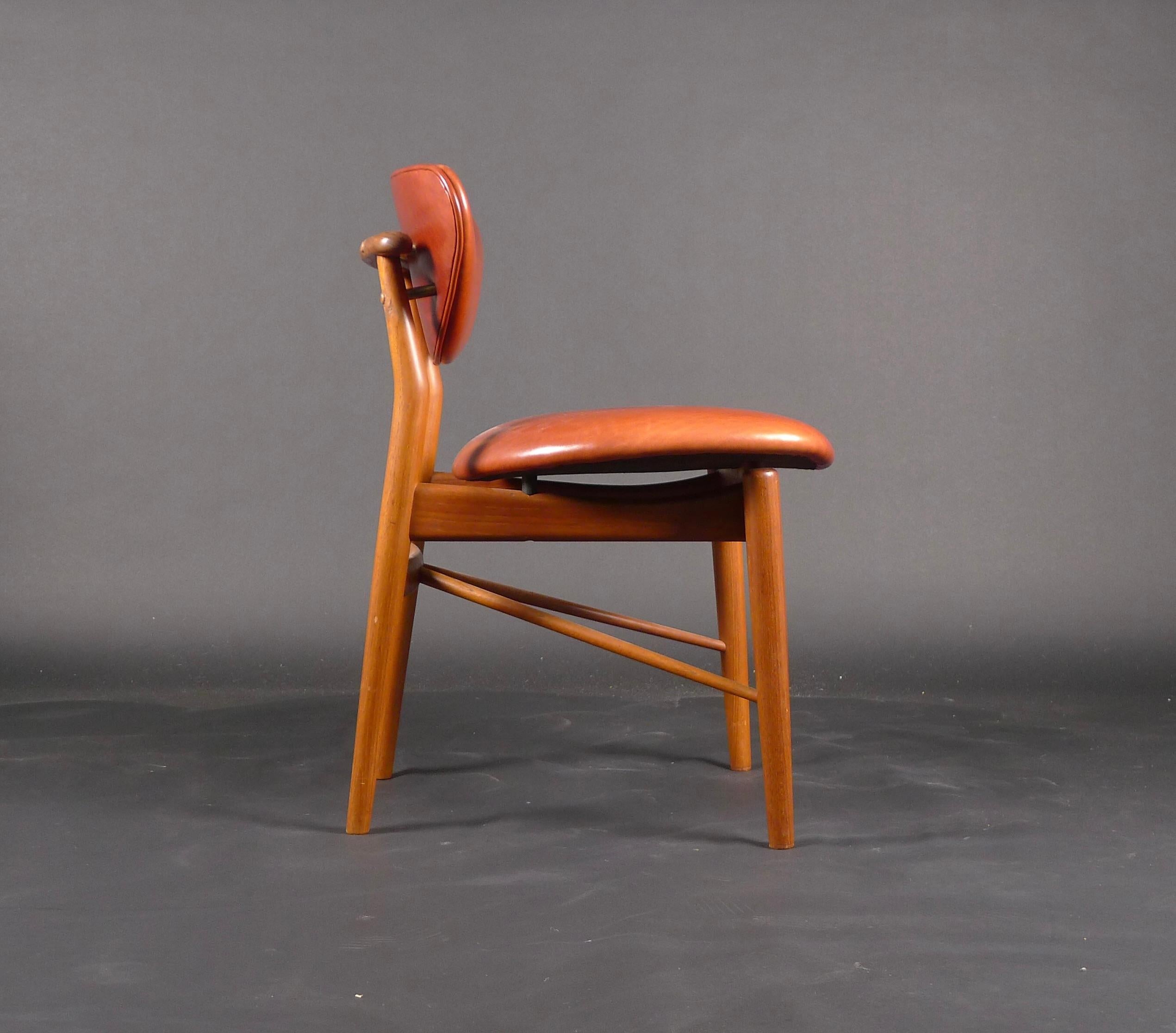 Finn Juhl, teak 108 Chair, 1946, made by Niels Vodder, Copenhagen, stamped

This is an early original chair, made by cabinet maker Niels Vodder in Copenhagen and bearing the stamped mark (see image). The condition is very good, and the chair has