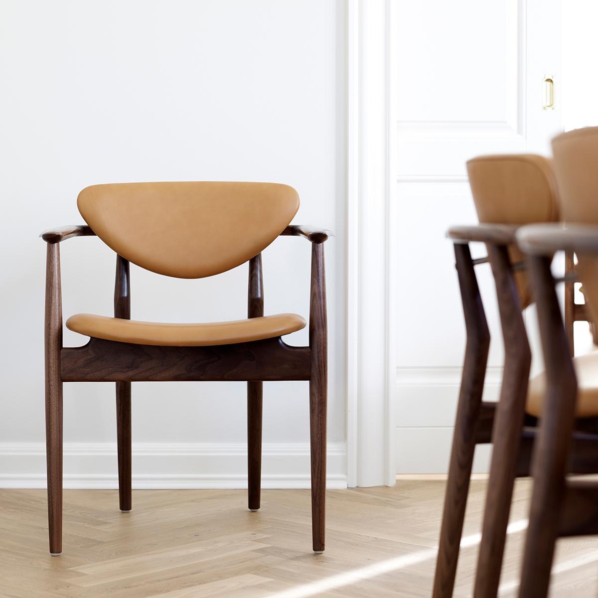 Chair designed by Finn Juhl in 1946, relaunched in 2009.
Manufactured by House of Finn Juhl in Denmark.

The 109 Chair was originally manufactured by cabinetmaker Niels Vodder, just like its close relative the 108 Chair. In this design, it is in