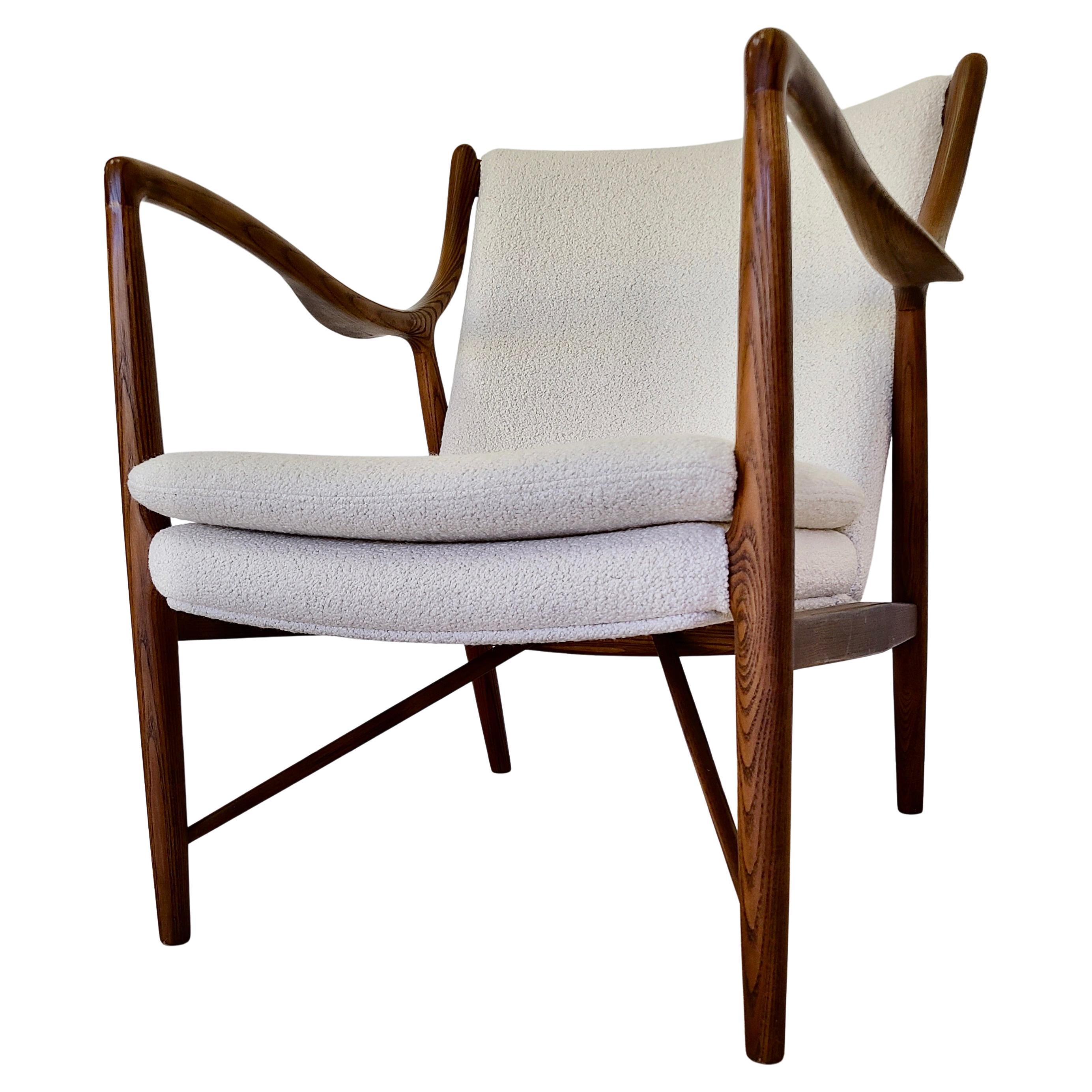 Please feel free to reach out for efficient shipping quote to your zip.

Finn Juhl 45 chair by J G  Furniture.
Original finish to Ash frame.
Redone in  Boucle'. 

J G Furniture was a premium modern furniture company post war who
offered original