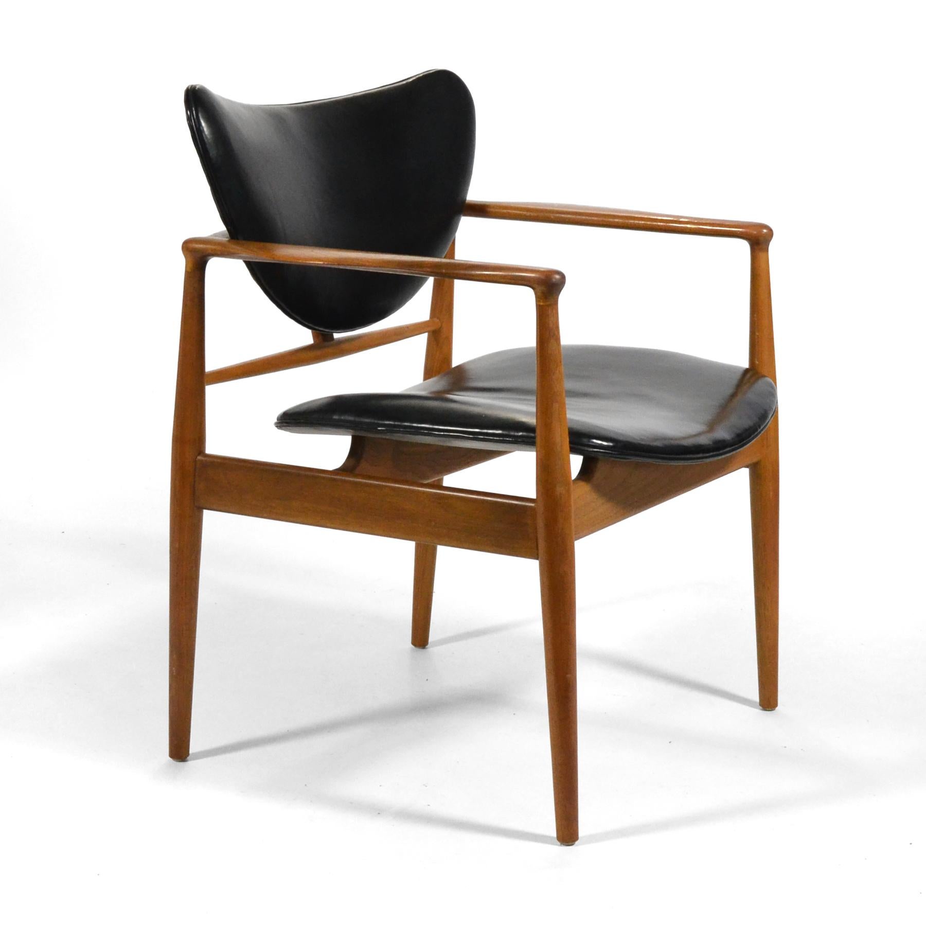 Acknowledged as the father of Danish modern design, Finn Juhl worked closely with cabinetmaker Niels Vodder to develop his innovative designs. Their collaboration was groundbreaking for separating the seat and back from the frame of the chair.
