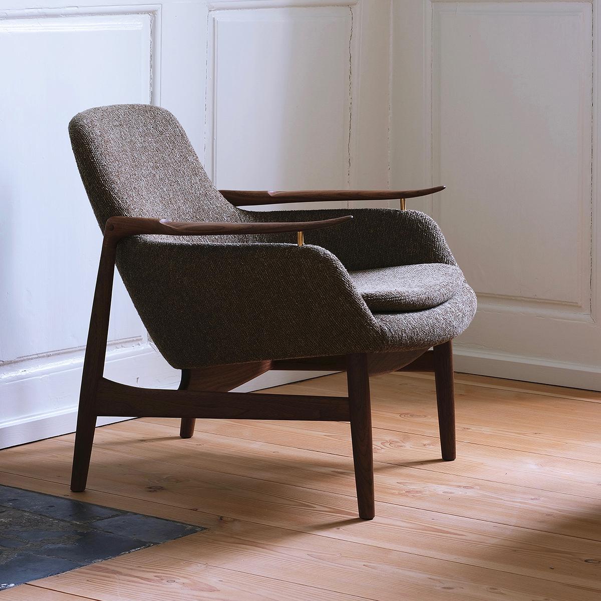 Finn Juhl 53 chair designed by Finn Juhl in 1953, relaunched in 2020.
Manufactured by House of Finn Juhl in Denmark.

The FJ 53 is an extravagant piece of furniture. It integrates the lightness and elegance of a wooden chair with an upholstered