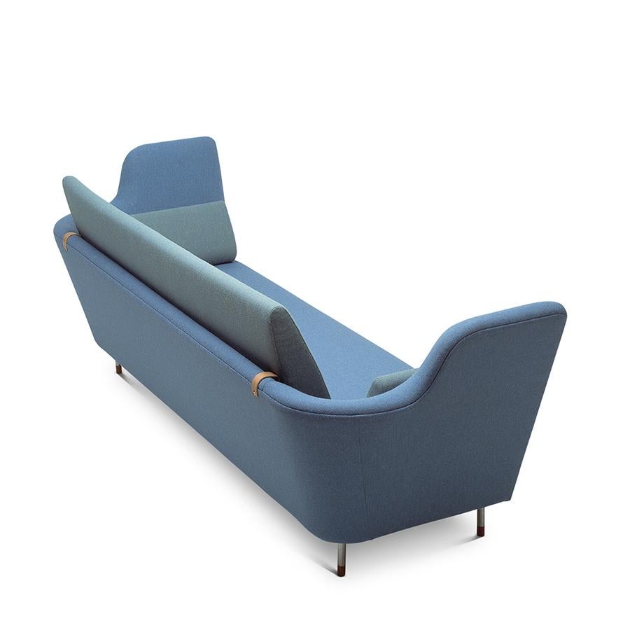 Sofa designed by Finn Juhl in 1957, relaunched in 2000.
Manufactured by House of Finn Juhl in Denmark.

The sofa was exhibited for the very first time in the Tivoli Gardens in Copenhagen during 1957. However, it took more than 40 years before