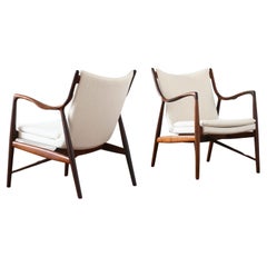 Finn Juhl, a pair of NV45 chairs in Rosewood for Niels Vodder, 1945