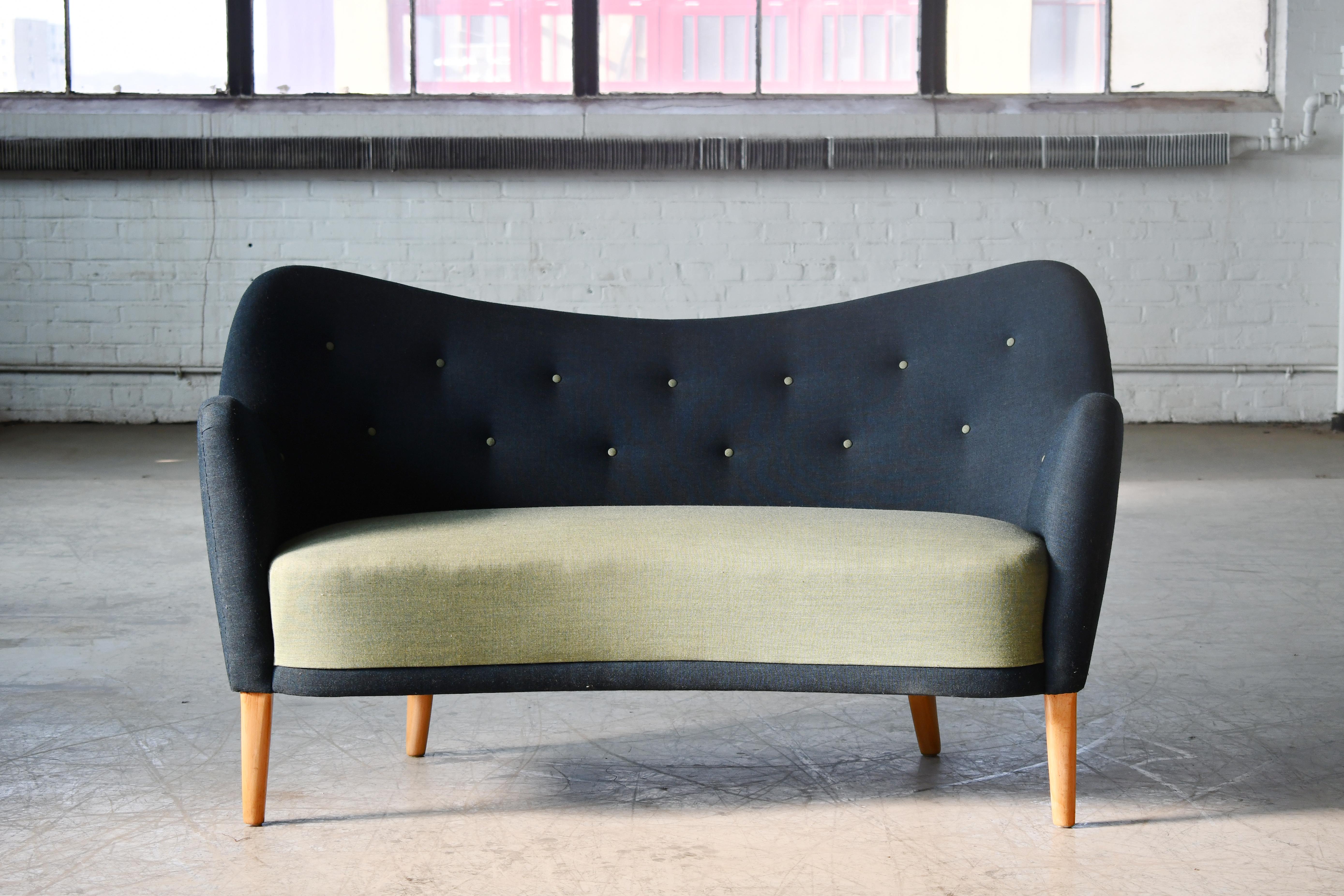 Superbly elegant Finn Juhl attributed sofa or settee made by Slagelse Mobelvaerk, Denmark sometime in the 1940s as model number 185. The lines and proportions of this design are just perfection. Solid and sturdy raised on beech legs. The fabric was