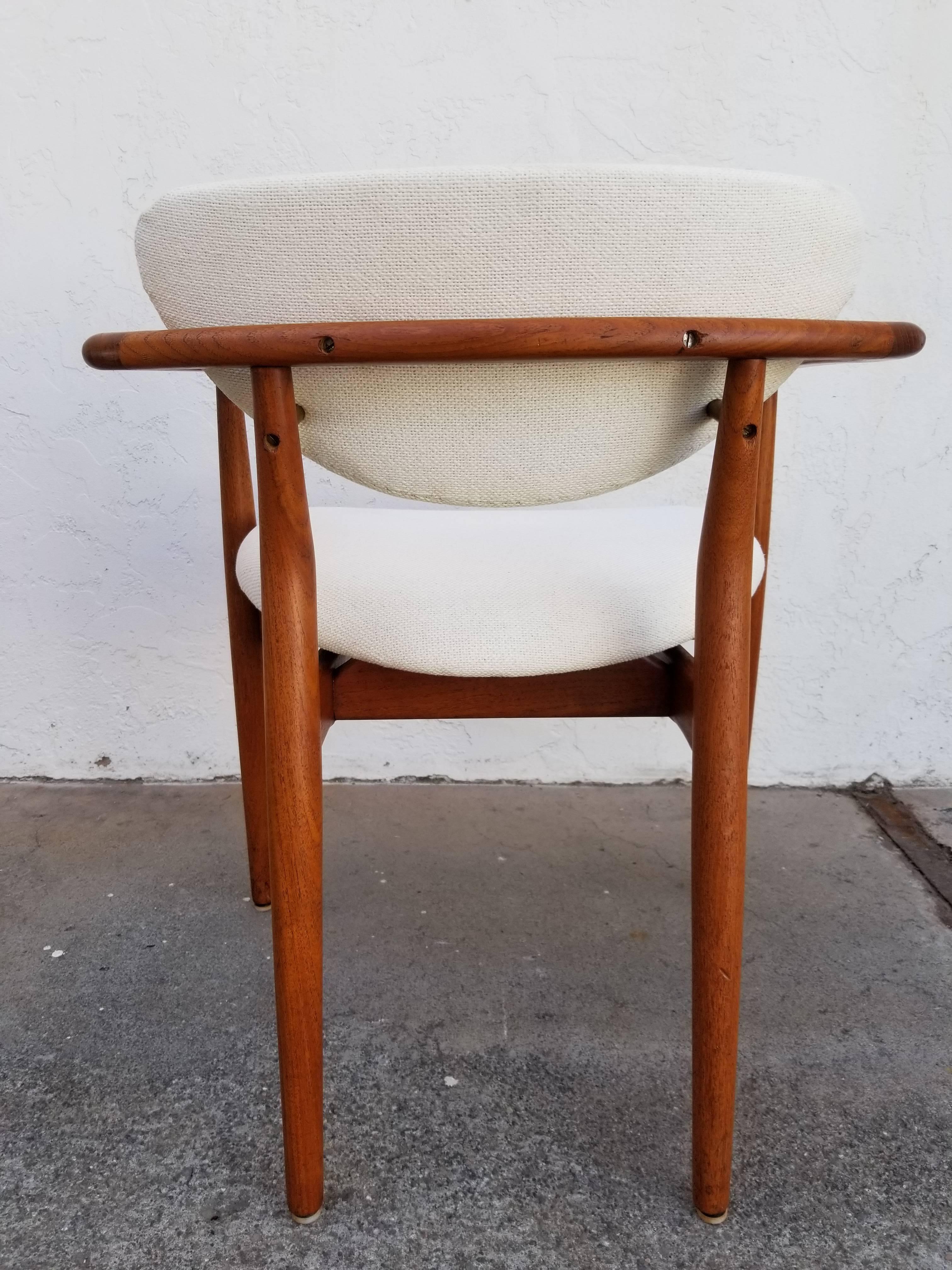1950s teak Danish Modern armchair attributed to Finn Juhl. Graceful, sculptural design, floating seat. All indications of design, material and fittings identical to Finn Juhl, but no markings or labels on this chair.