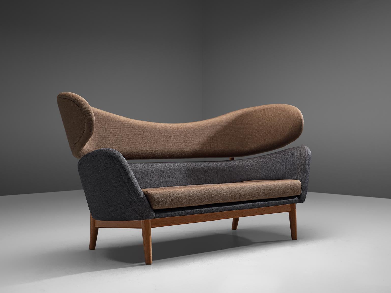 Finn Juhl, 'Baker' sofa, fabric and oak, Denmark, design 1951, recent production.

The Baker sofa was originally designed for Baker Furniture Inc., USA in 1951. In its modern design, Finn Juhl used a two-piece curved back that embraces the sitter