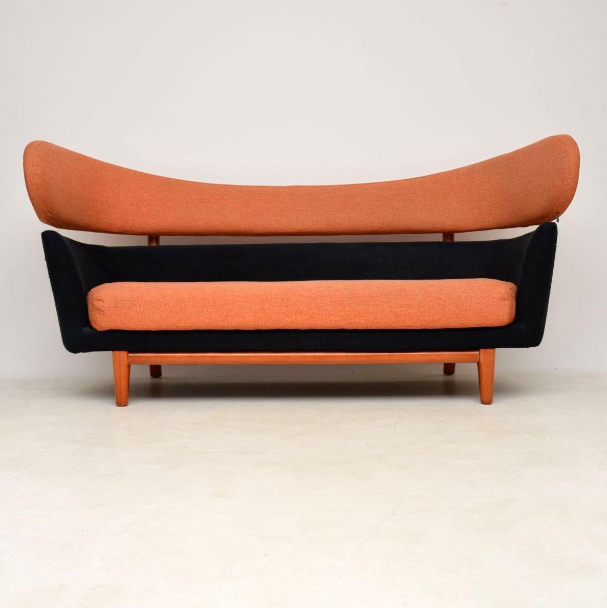 This is a very high quality retro style sofa, inspired by the Classic Finn Juhl design for Baker furniture in the 1950’s. This example dates from the late 20th century, it’s very well made and is in very good condition. There is just some light
