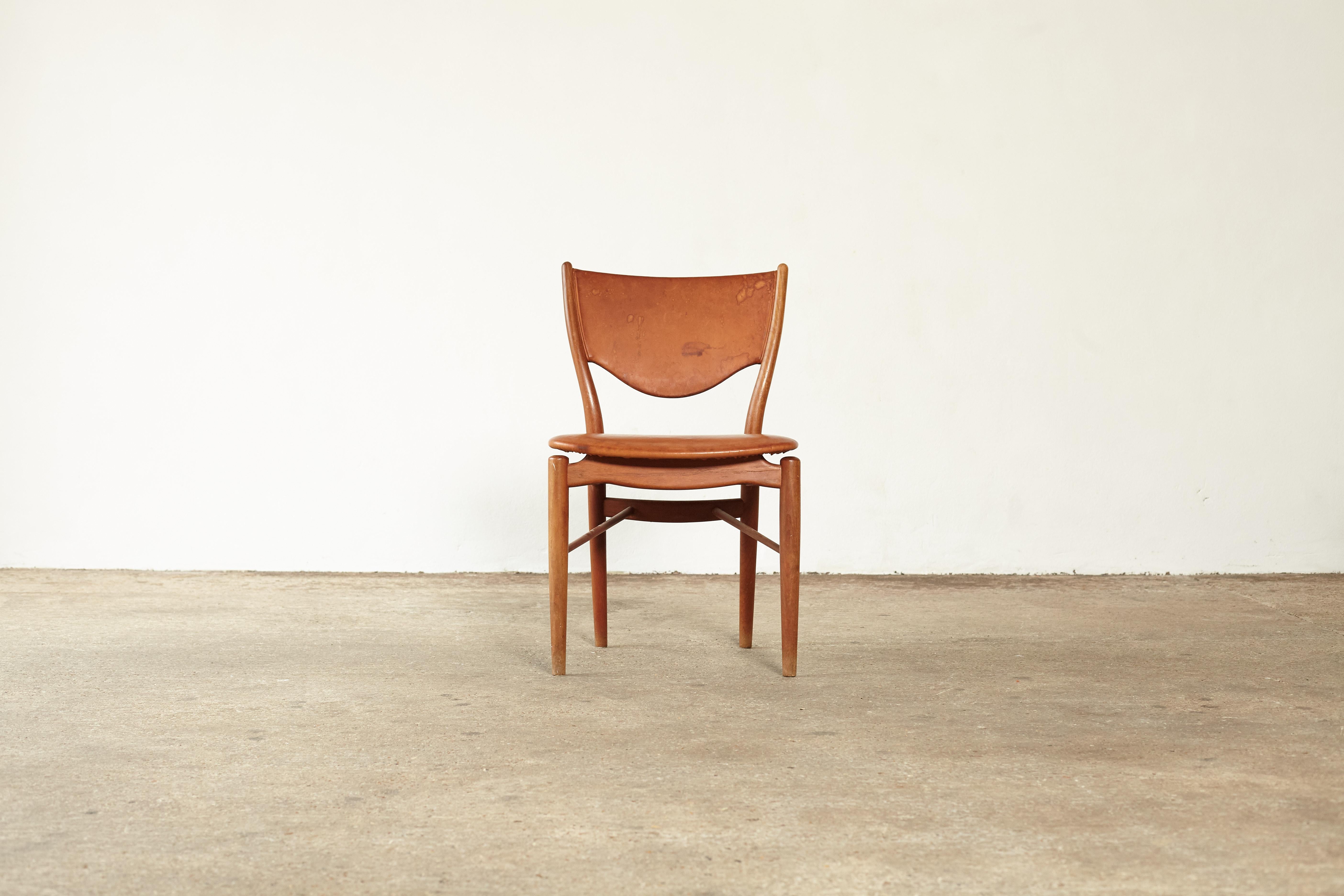 Finn Juhl BO 63 chair, designed in 1949 and manufactured by Bovirke, Denmark. Teak wood with seat and back upholstered in leather. This model was also manufactured by Niels Vodder at a later date and was called the NV 64. Good structural condition,