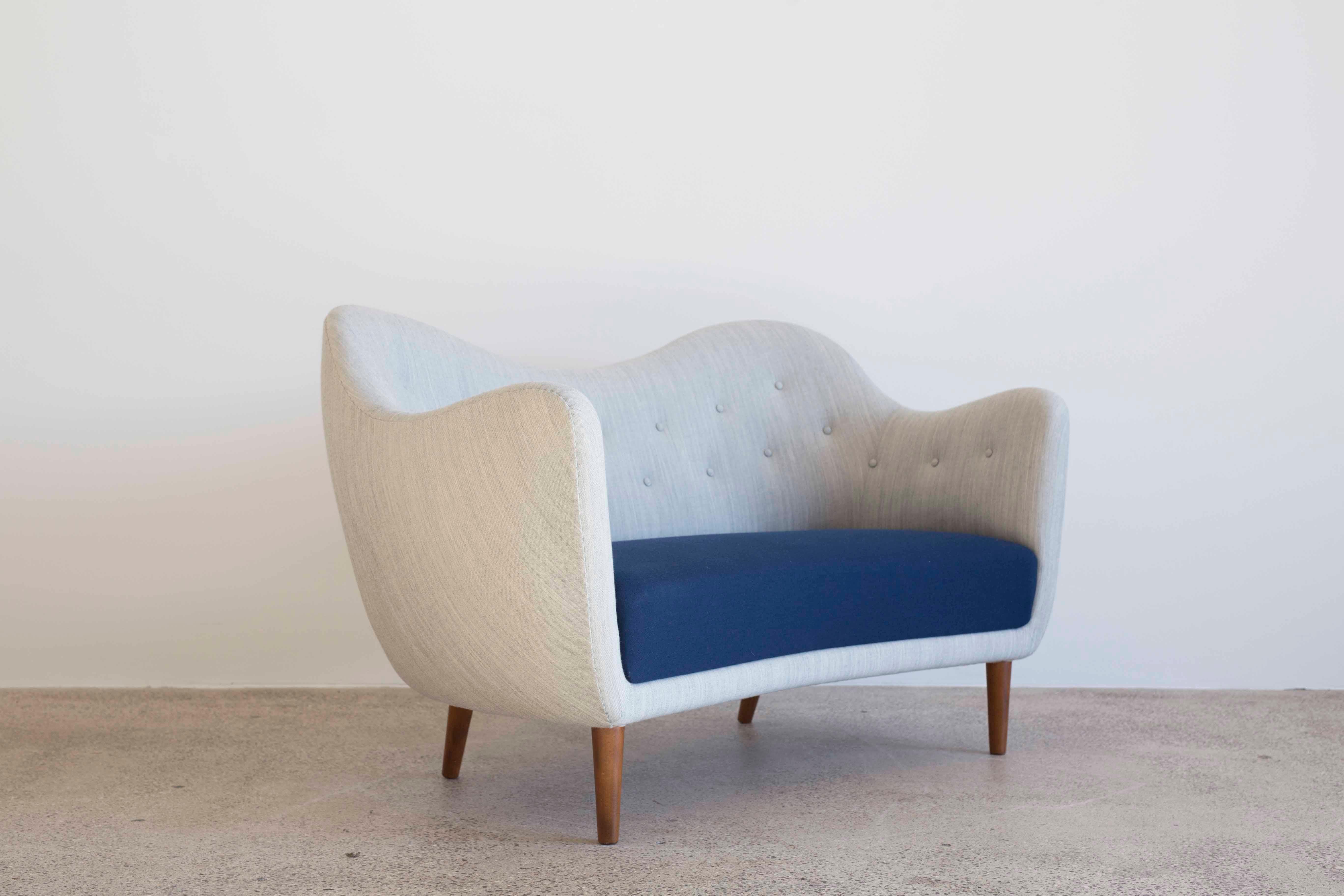 Finn Juhl sofa, designed 1946 and manufactured by Bovirke, Denmark, model BO46.
Fabric upholstery and tapering legs of stained wood.

 