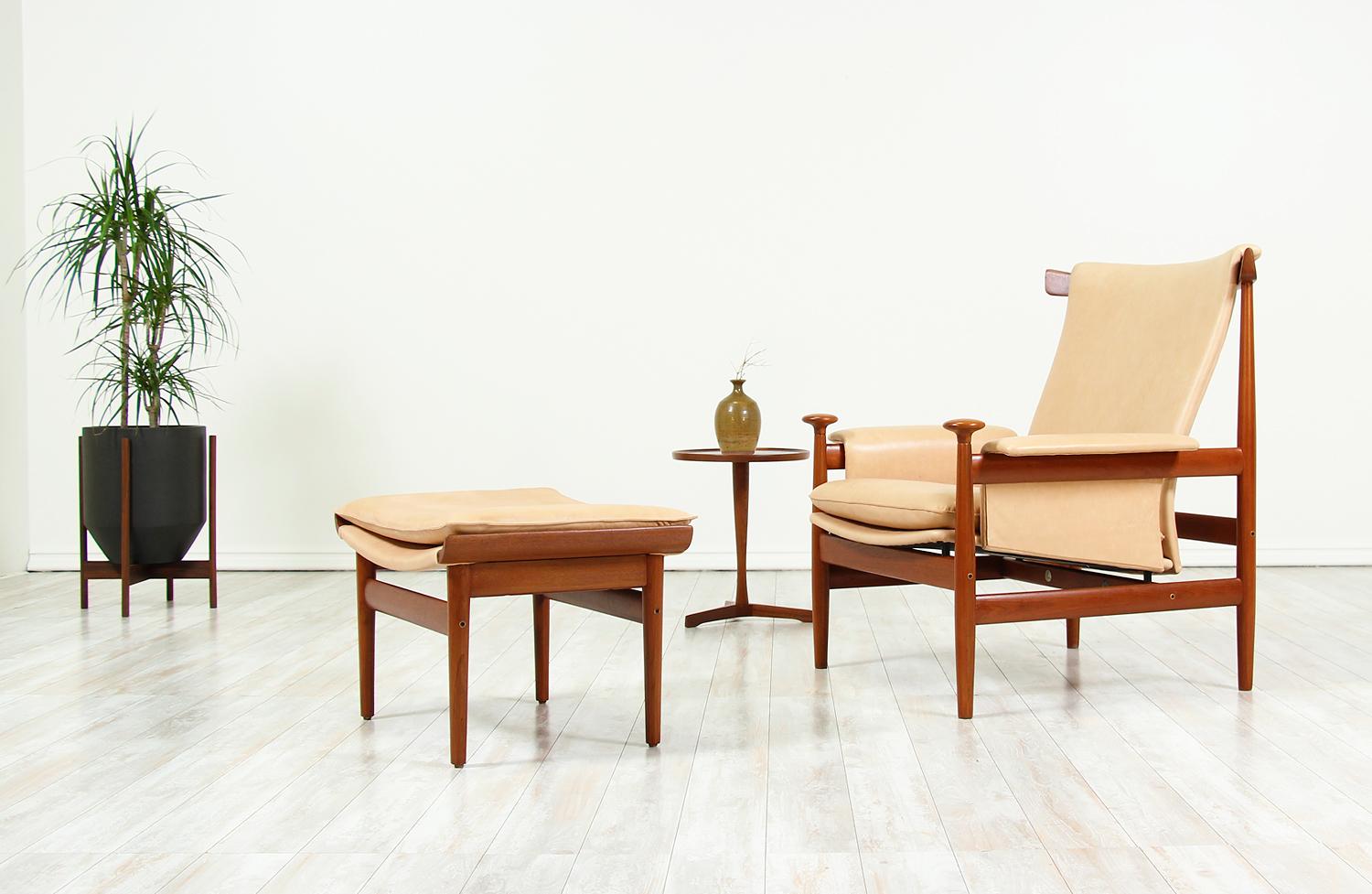 Iconic Danish modern “Bwana” chair and ottoman designed by Finn Juhl for France & Son in Denmark in 1962. Originally designed as an updated version of the Chieftain chair, the Bwana model-152 chair features a sculpted teak wood frame and new full