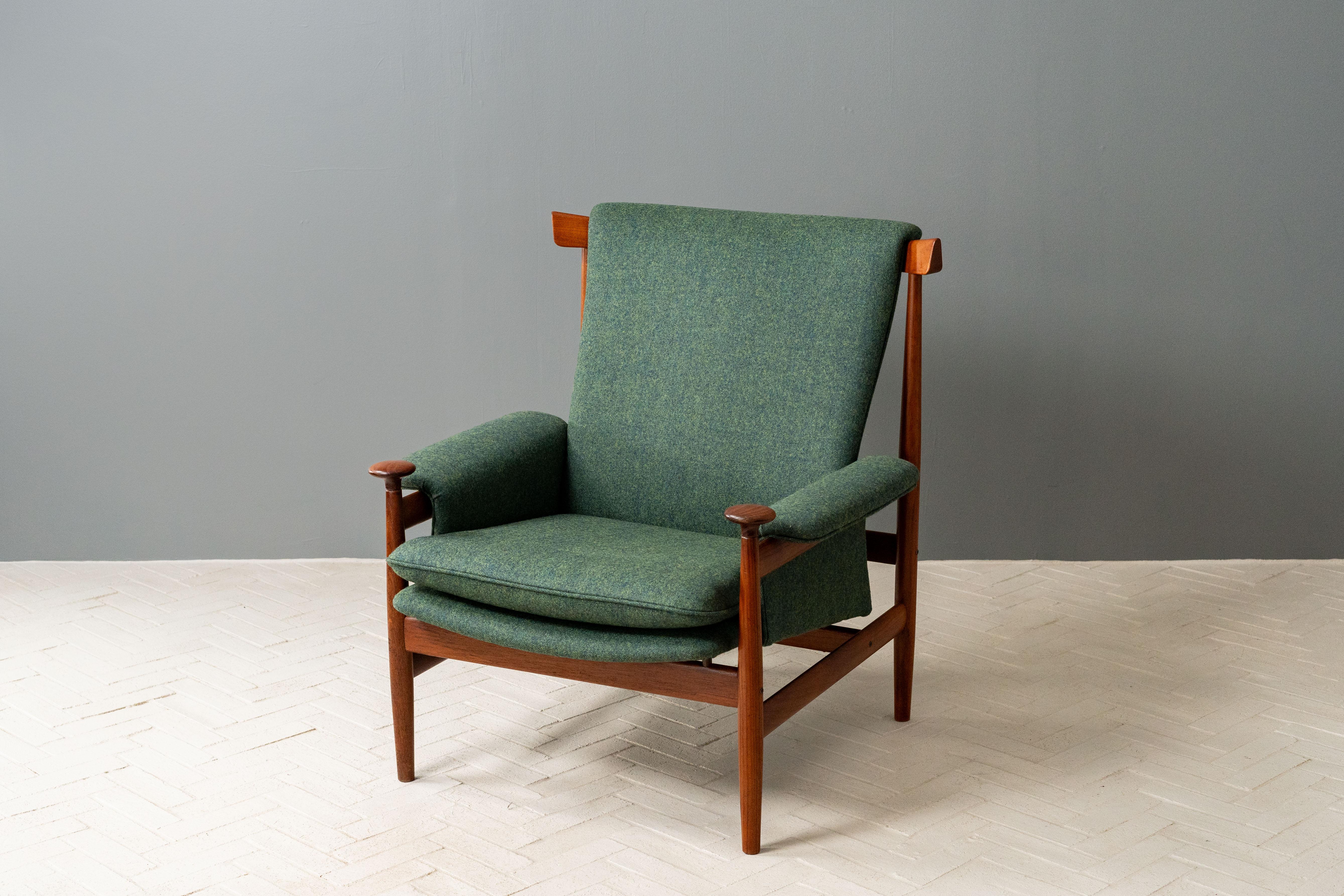 Denmark, ca. 1960s. A rare Model 152 Bwana Lounge Chair by Finn Juhl for France & Son - retailed by John Stuart of NYC. Features solid teak construction with a high back, sculptural curved arms, and floating seat. Distinctive pommel handrests and