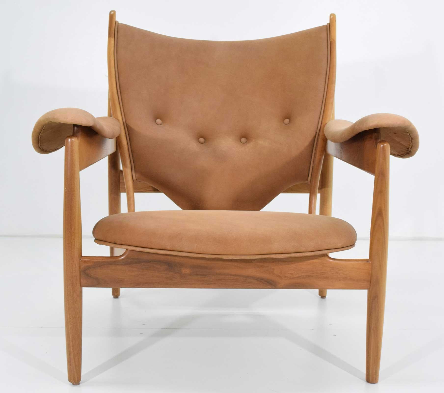 This is the most important of Finn Juhl's chair designs. Shown at the Cabinetmakers Guild in 1949, Denmark's King Frederik is claimed to have sat in the chair and so it was called the Cheiftain or Egyptian chair. Finn Juhl signed a contract with