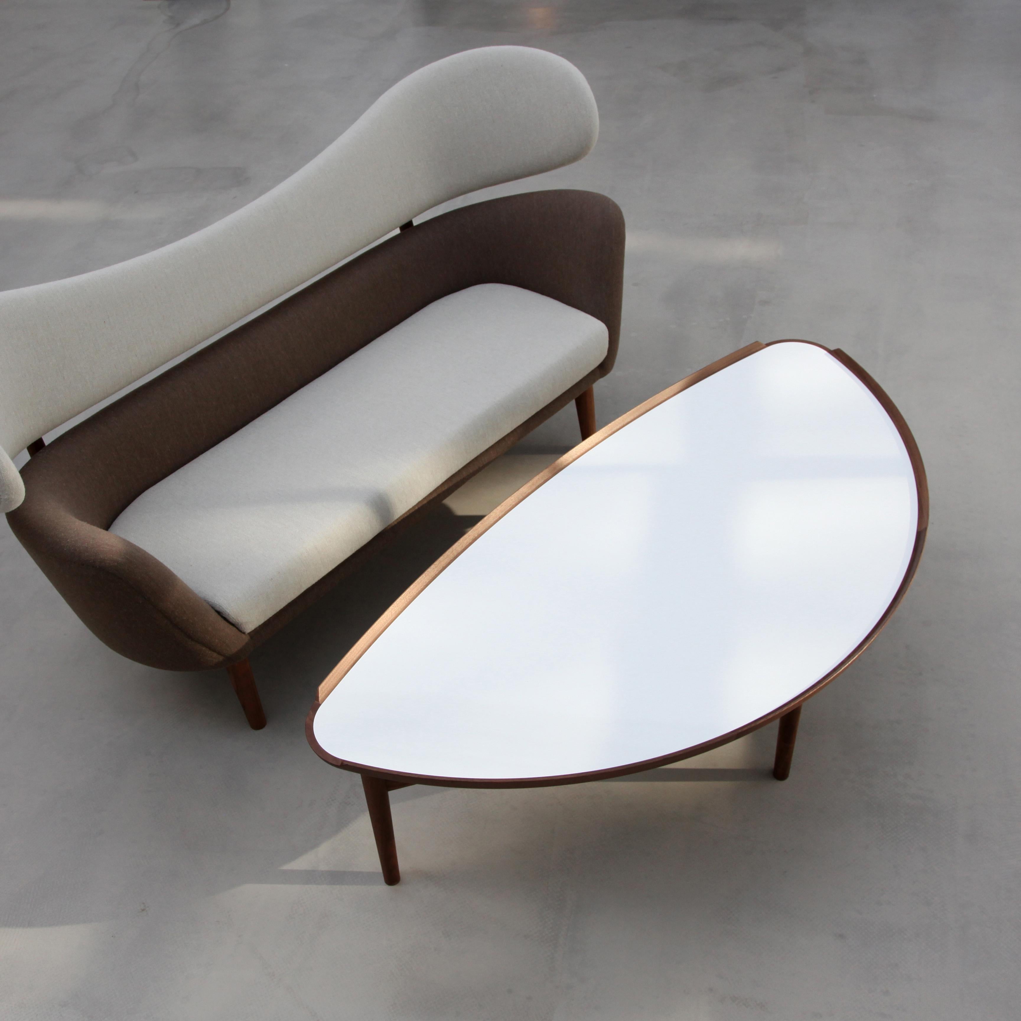 Table designed by Finn Juhl in 1951, relaunched in 2009.
Manufactured by House of Finn Juhl in Denmark.

Finn Juhl’s cocktail table was designed for Baker Furniture in the United States to match the sculptural Baker Sofa.

The economy was