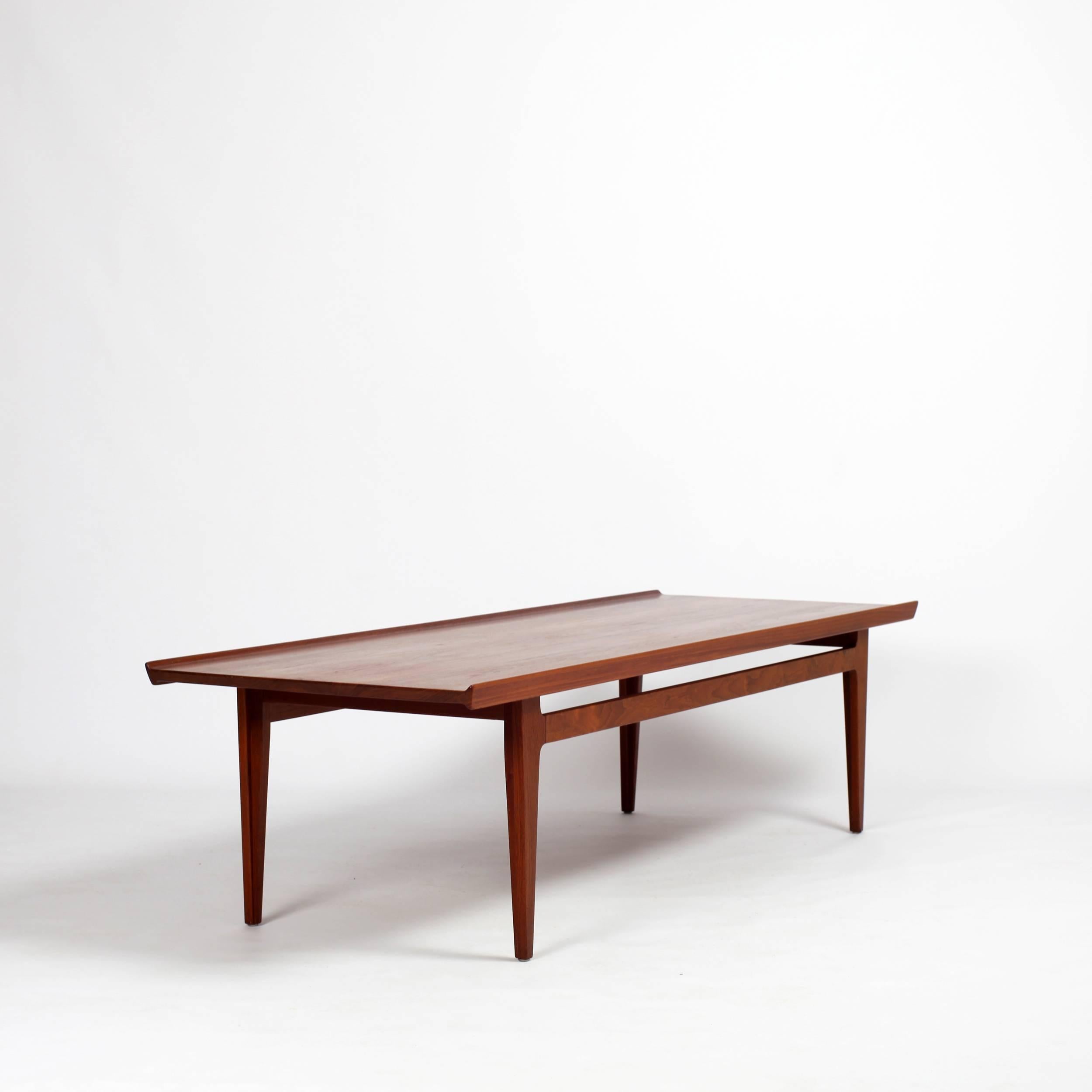 Very long teak coffee table mod 531 designed by Finn Juhl for France & Daverkosen Denmark from the 60s.
very elegant with his raised edges
Stamped France & Daverkosen and France & Son.
Nicely professional restore on a corner (last photo).
Reference: