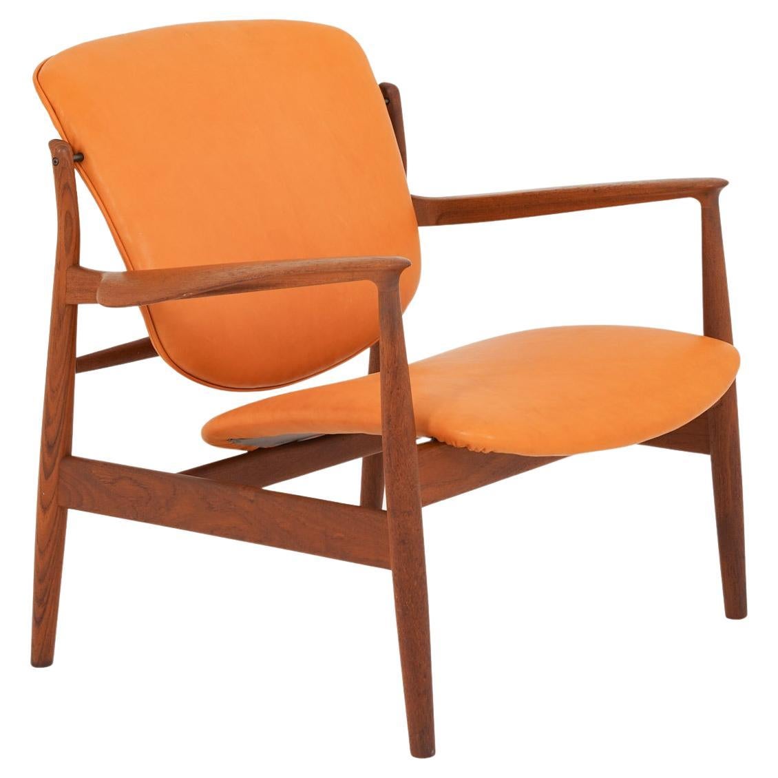 Finn Juhl Cognac Leather and Teak Lounge Chair model FD 136