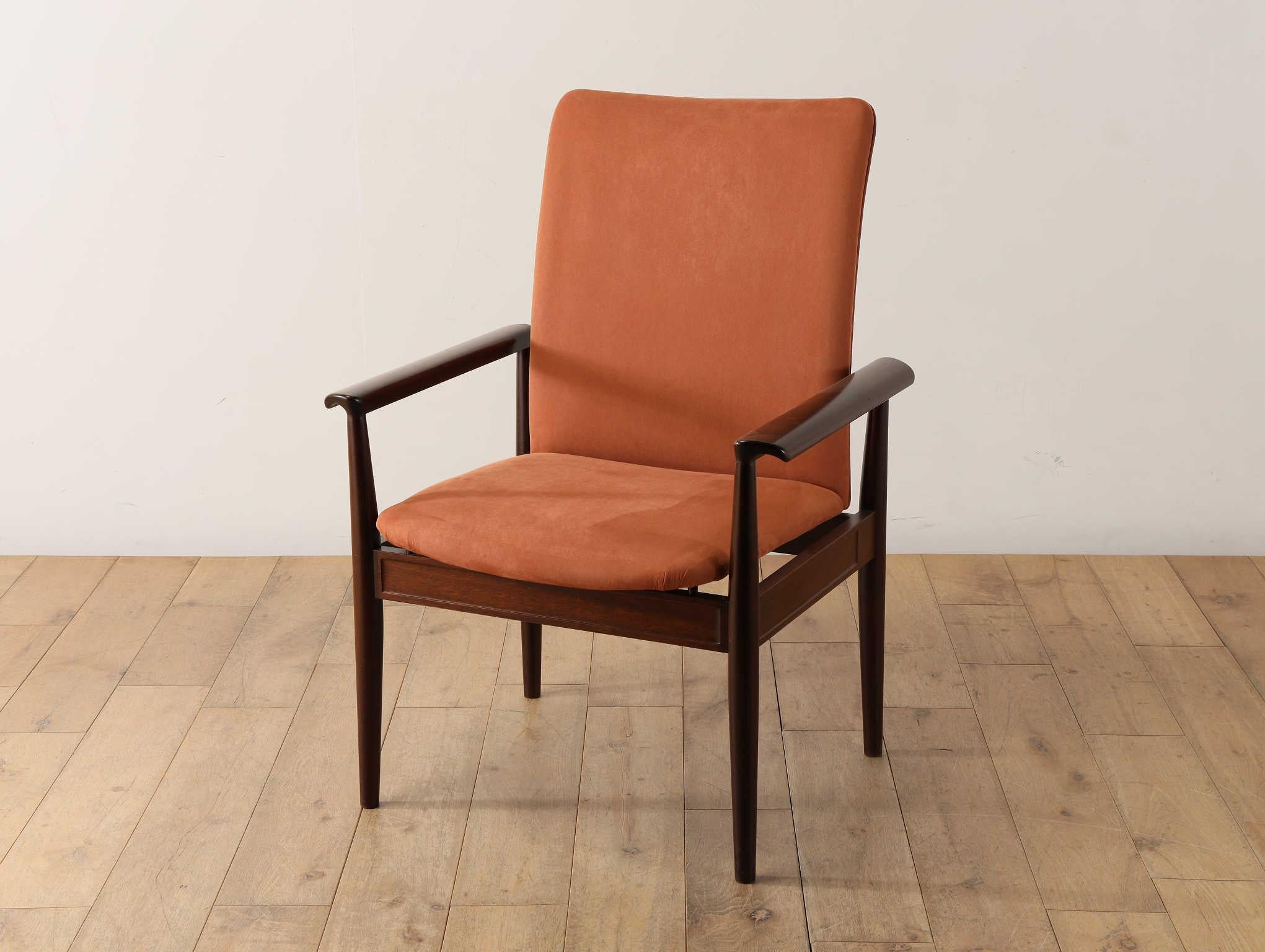 Designed by leading Danish furniture designer Finn Juhl, this chair, FD209, also known as the Diplomat chair, was designed for embassies in 1963 and presented by France & Son. The original version has a solid rosewood frame, while this one is made