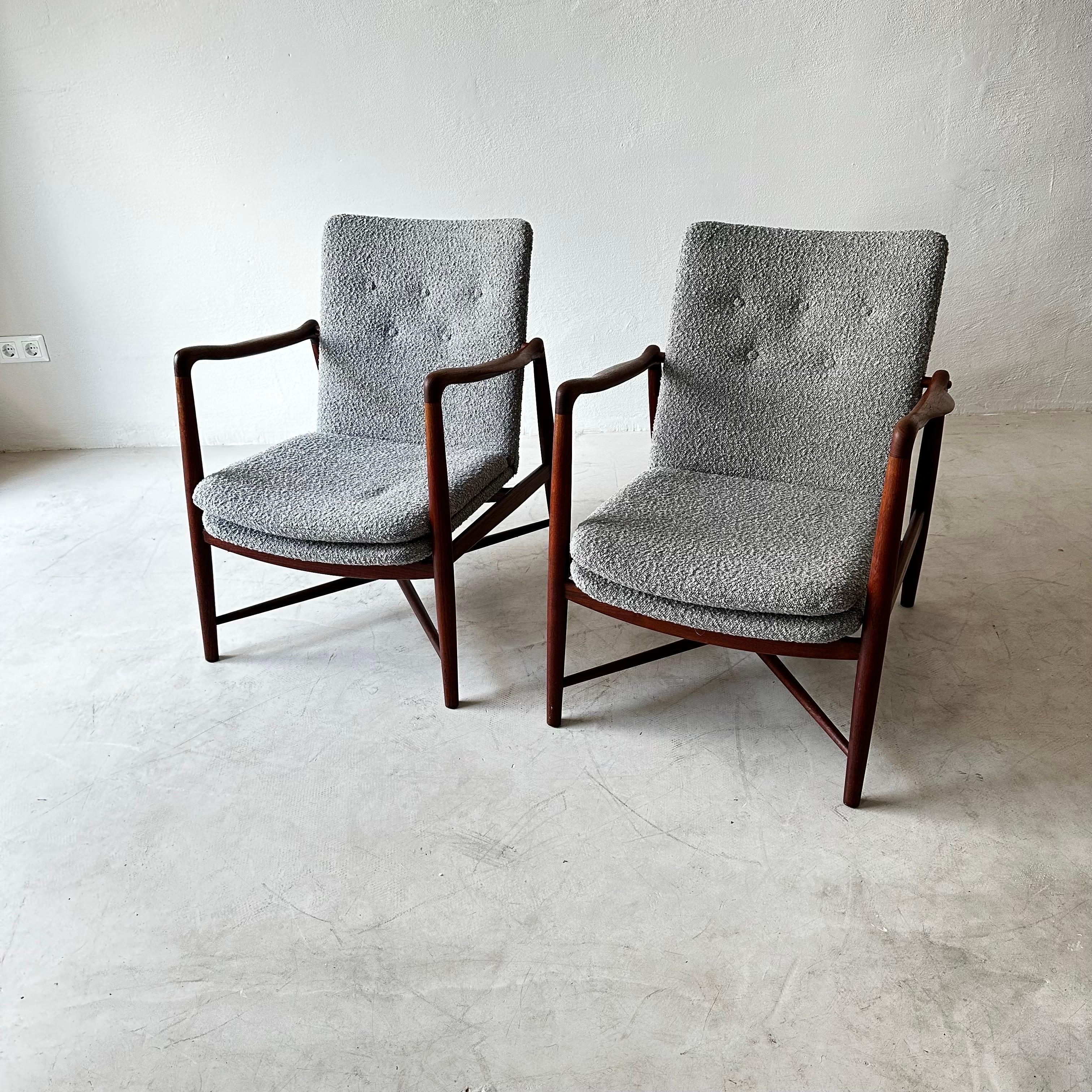 Rare pair of easy chairs model BO59/ fireplace chair designed by Finn Juhl. Produced by Bovirke in Denmark. Teak and newly reupholstered in grey boucle fabric.
