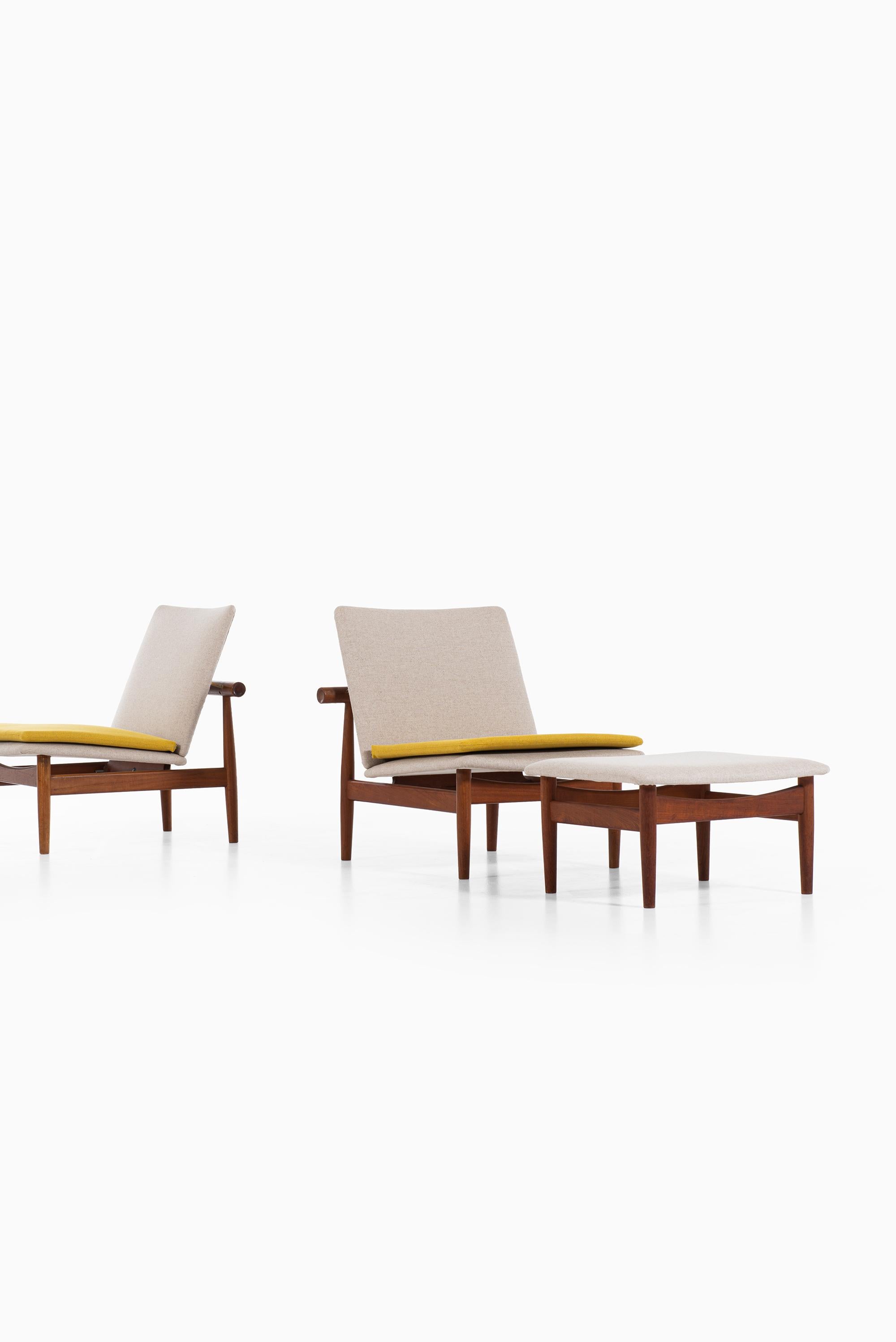 Rare pair of easy chairs model Japan / FD-137 with foot stools designed by Finn Juhl. Produced by France & Son in Denmark.