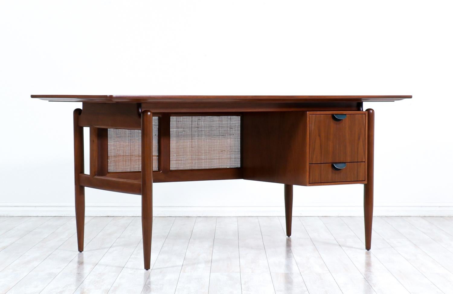 Finn Juhl executive walnut desk with caning for Baker Furniture.