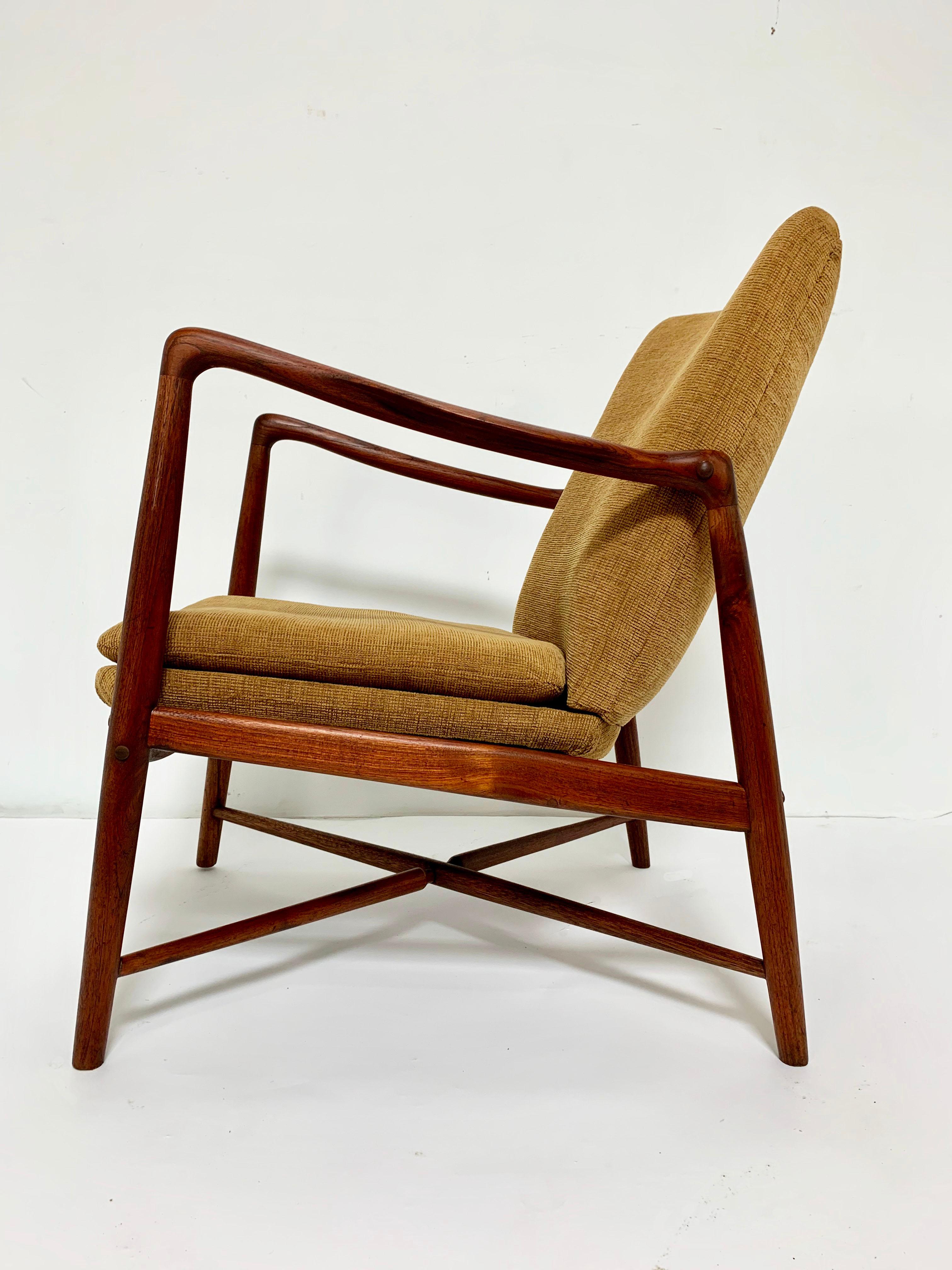 A “fireplace chair” in teak, model BO59, designed in 1946 by Finn Juhl for Bovirke Furniture of Copenhagen. Only a year prior, his model 45 chair for Niels Vodder had been released to such instant acclaim that Bovirke commissioned this correlative