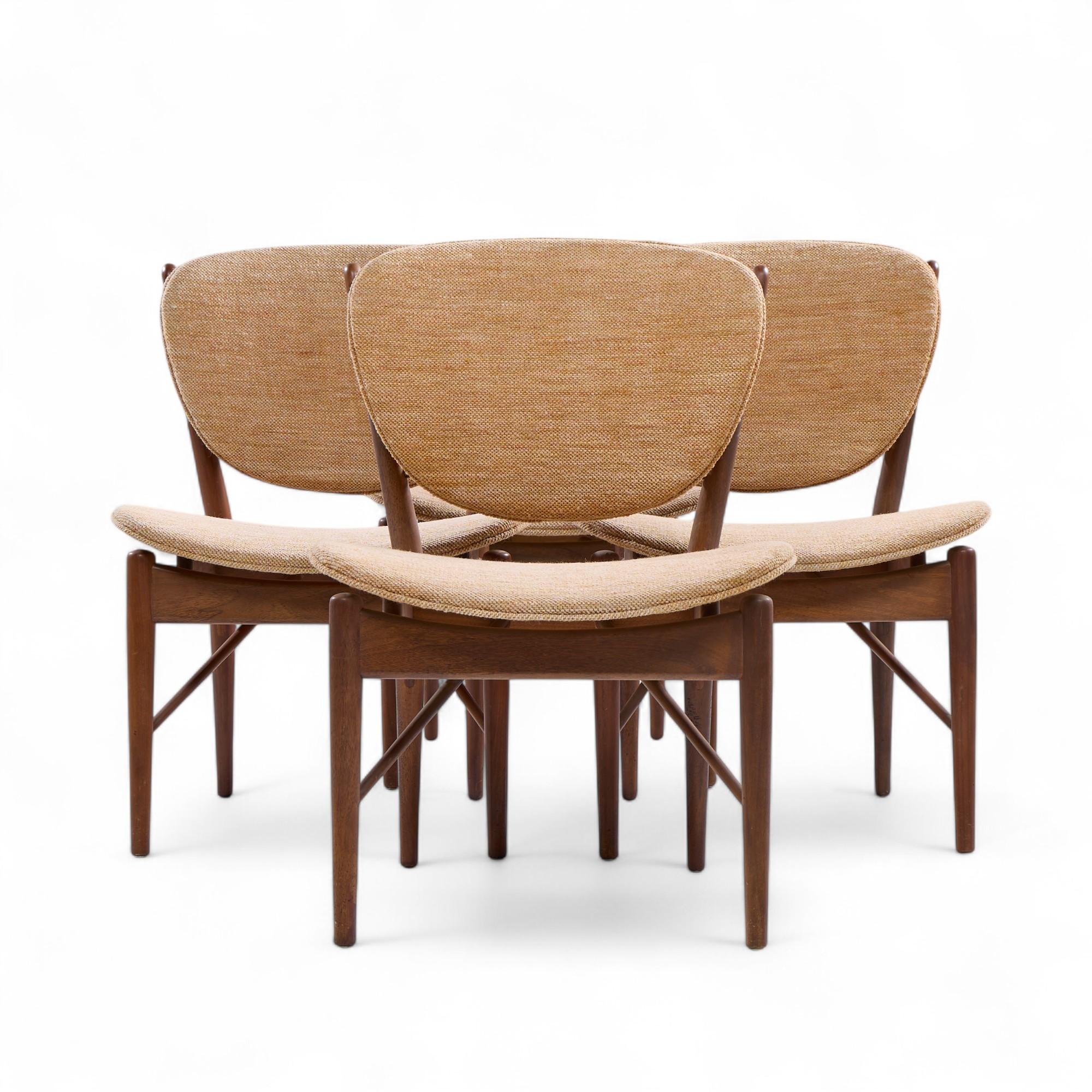 Finn Juhl for Baker Model 51 Mid Century Walnut Dining Chairs - Set of 4

Each chair measures: 22.25 wide x 21.5 deep x 32 inches high, with a seat height/chair clearance of 16.5 inches

Good Vintage Condition - Chairs Have Minor Scuffs and Gentle