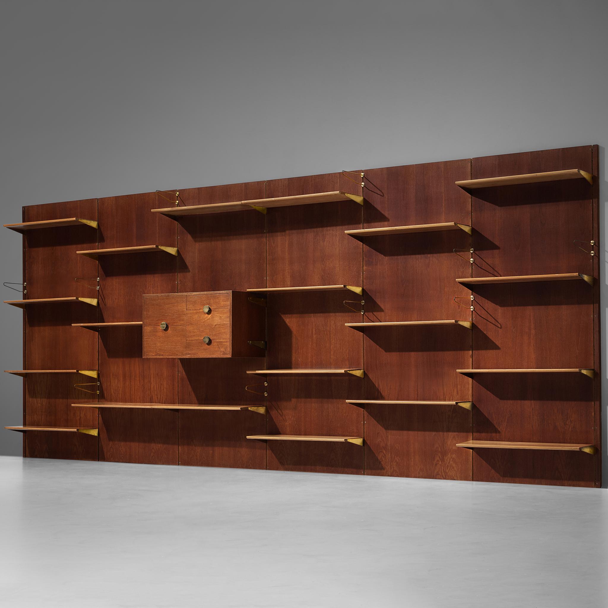 Finn Juhl for Bovirke, wall unit, model 'BO71', teak, pine, brass, Denmark, 1950s 

This eccentric library unit designed by the renowned designer Finn Juhl is based on an elongated construction, offering a variety of different storage possibilities.